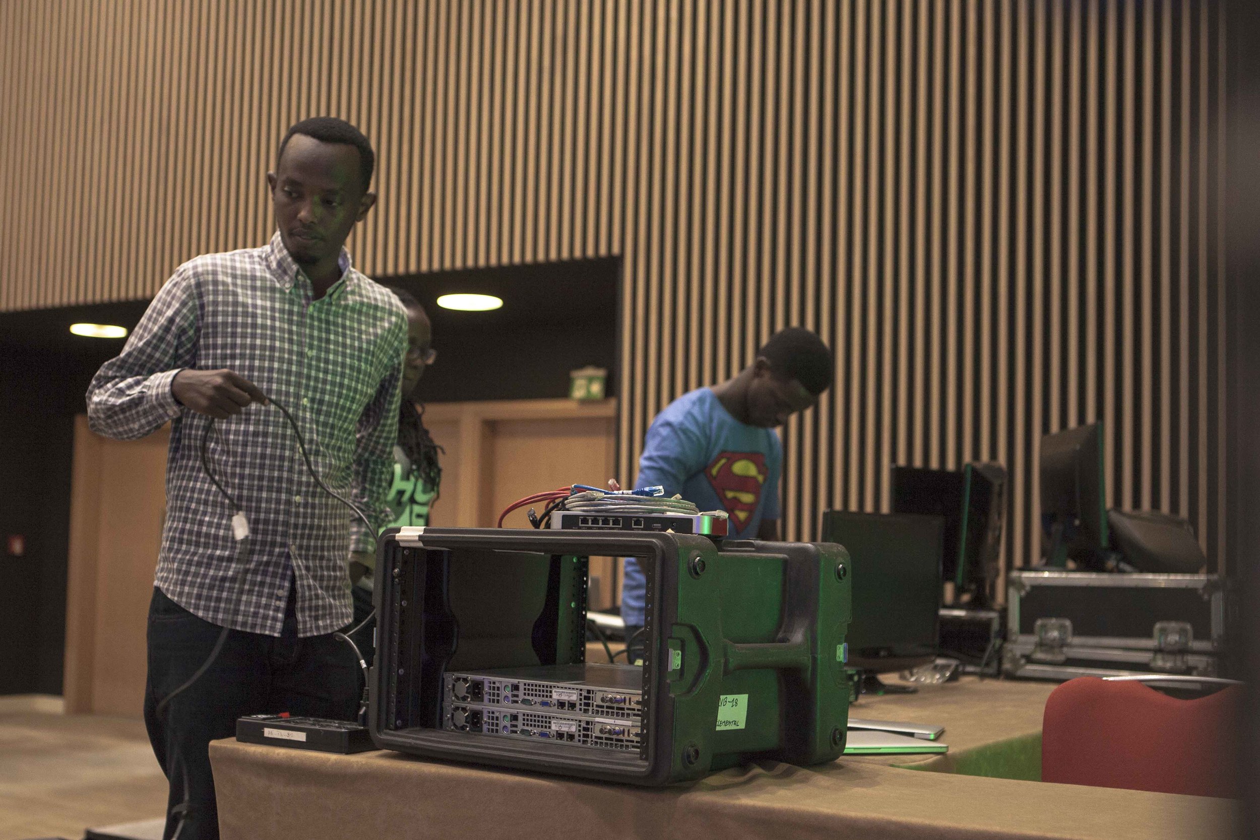 Alan and Bruce, two ADMA students, setting up the equipment that will be used for the live streaming