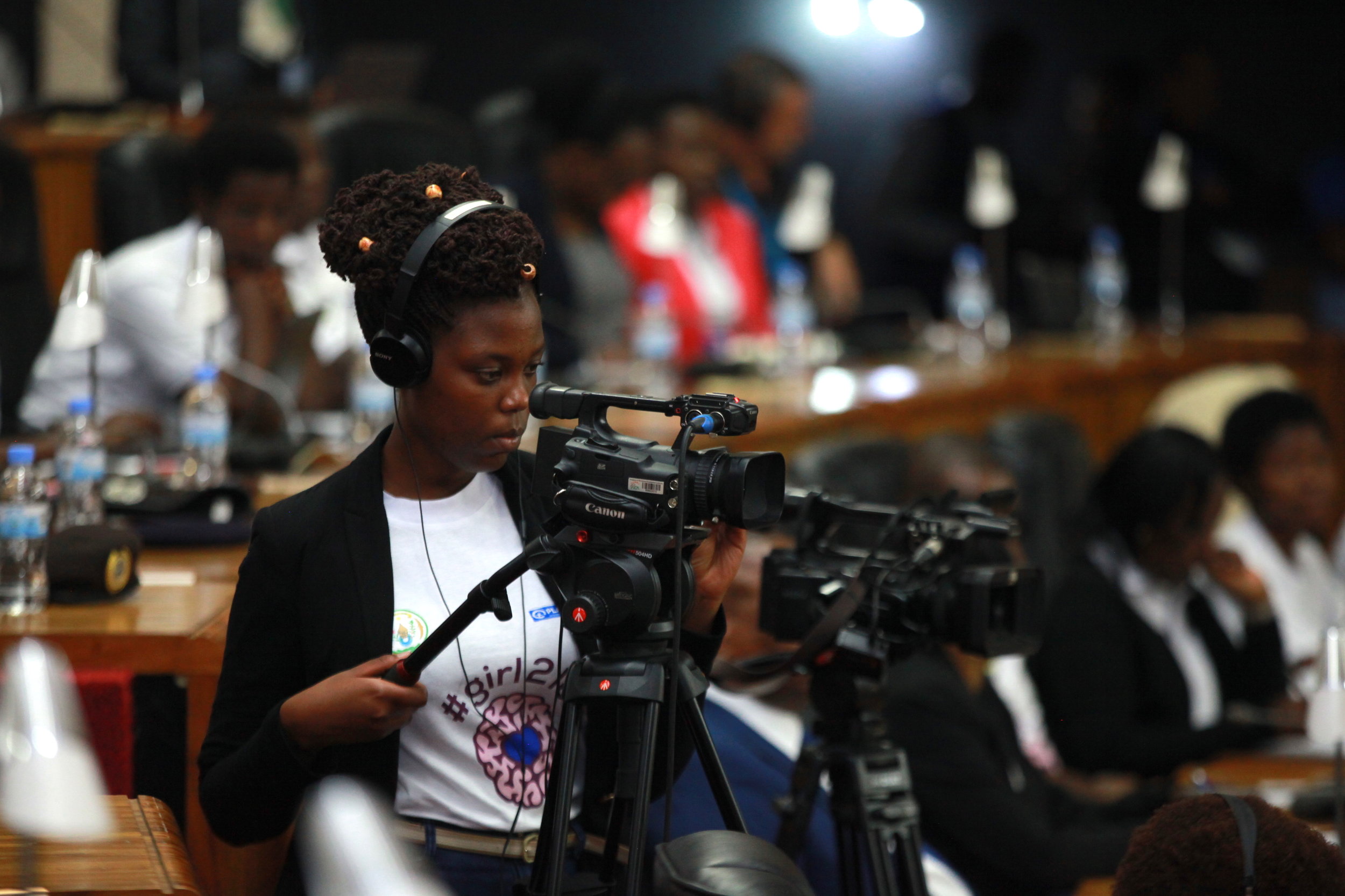 ADMA student Sandrine on an XF105, capturing video footage closeups of speakers on the main stage.