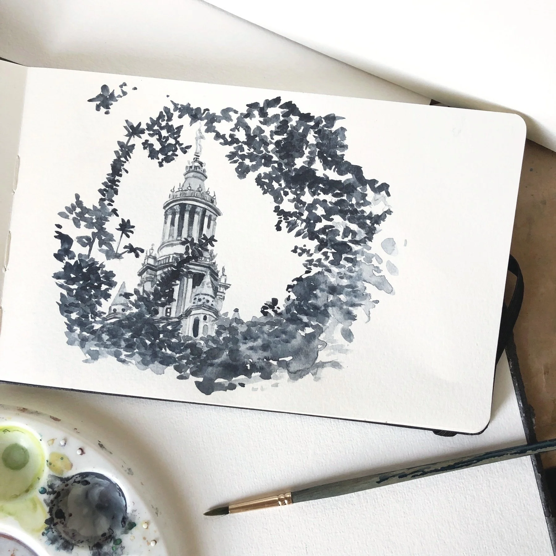 Watercolour architecture sketch of New York tower through a break in the leaves