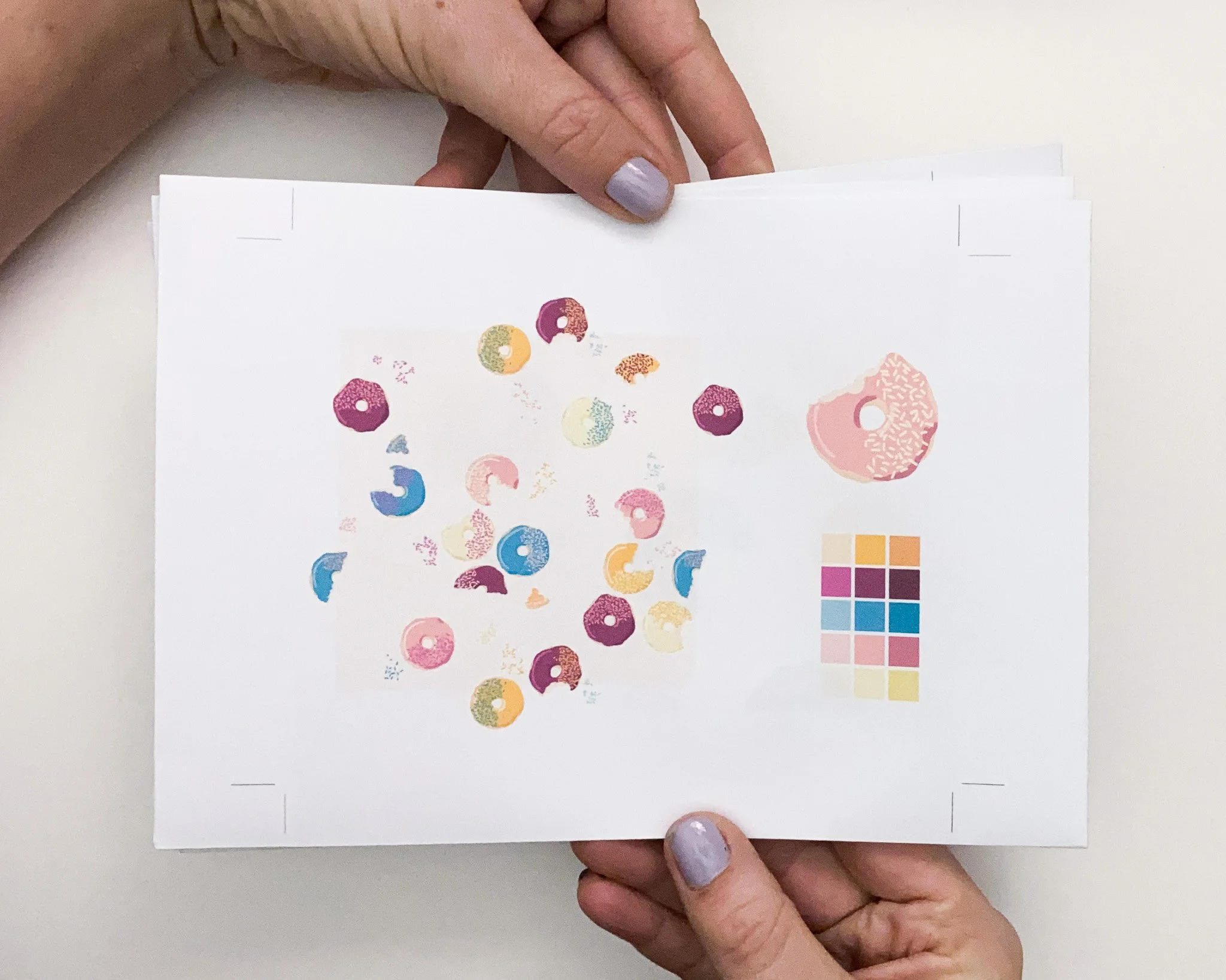 pattern block featuring doughnut motif in soft pink, blue and maroon colours on creamy background for surface pattern design