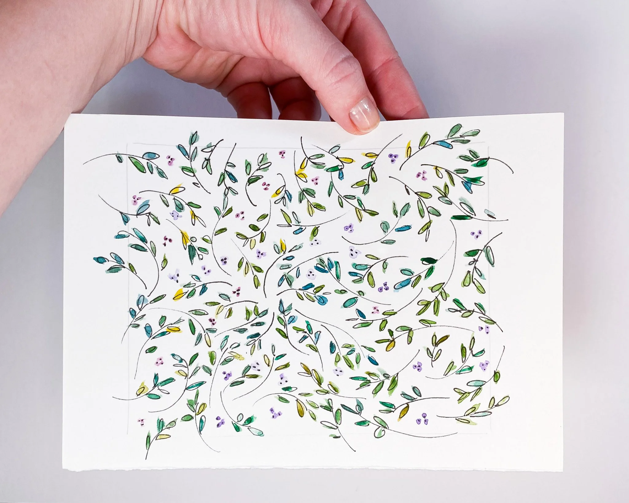 Surface pattern study with abstract mini floral and leaf motifs in green tones, ink and watercolour sample