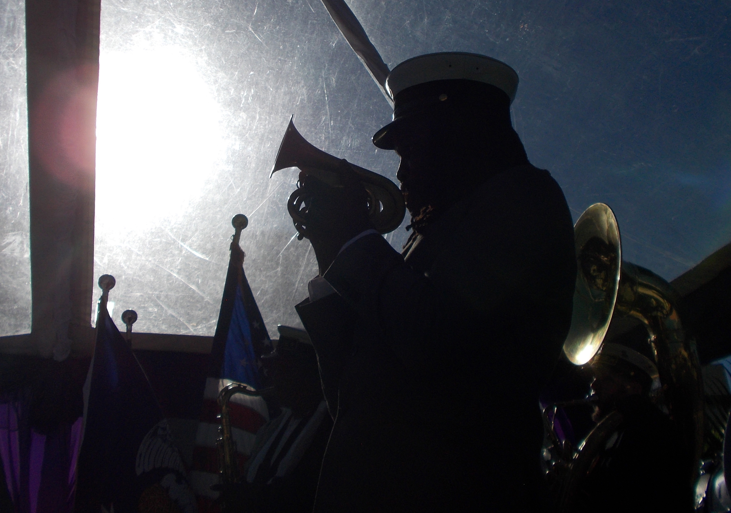  A member of the Tremé Brass Band is silhouetted against the sun as the band plays at the Rampart Streetcar Line ground breaking ceremony on January 28, 2015. 