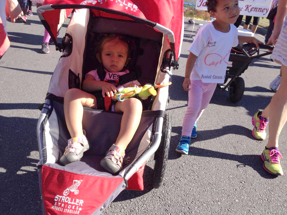  Olivia, left, and Desmond, children of Infinity Race for the Cure team members, take part in the 5K walk to raise awareness and funds for breast cancer. 