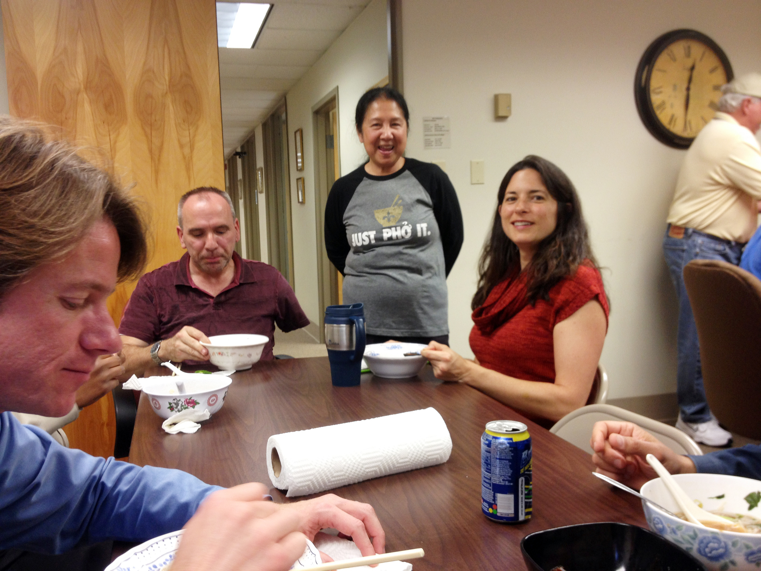  Infinity staff celebrate company and employee anniversaries with a pho lunch prepared by designer Phan Nguyen. From left, Bill Thomassie, Mike Laux, Phan Nguyen and Rachel Kenney. 