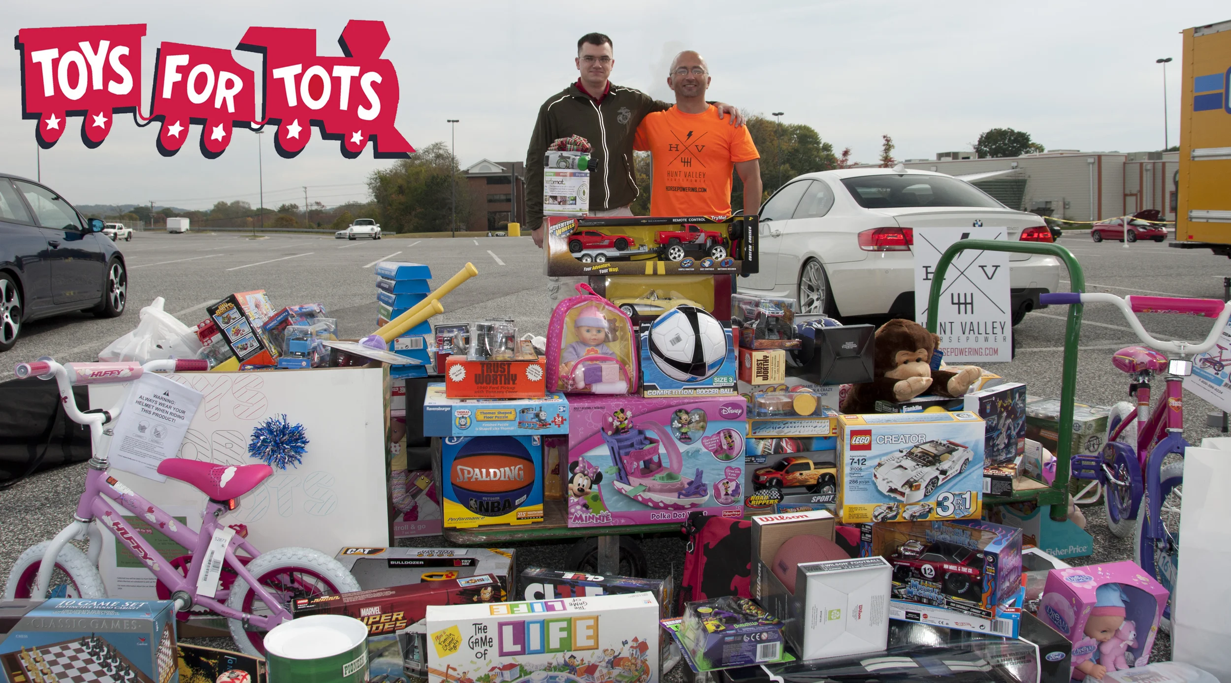 Toys For Tots Loading U-Haul + Big Logo.jpg