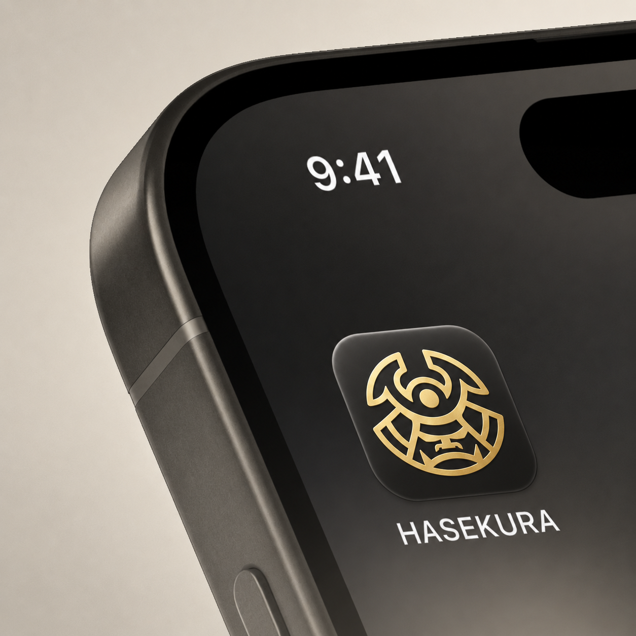 Close-up of an iPhone screen displaying the time 9:41, with a HASEKURA application icon featuring a gold geometric design and the app name below.