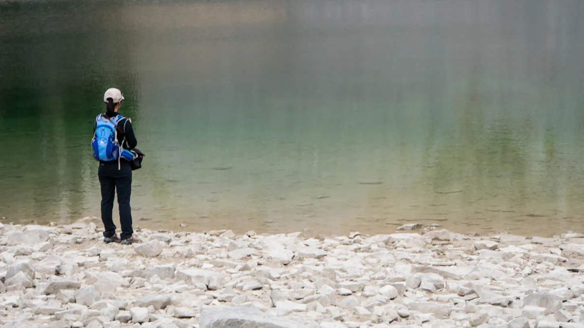 Rouxie contemplates the lake.