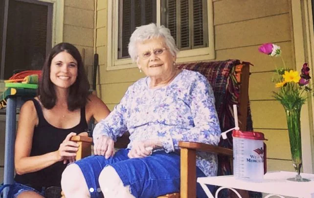 Me with grandma, enjoying her back yard.
