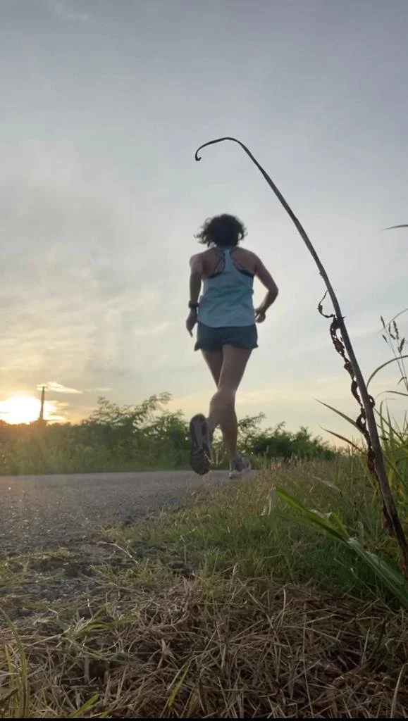 POV: woman running by construction sites in the summer