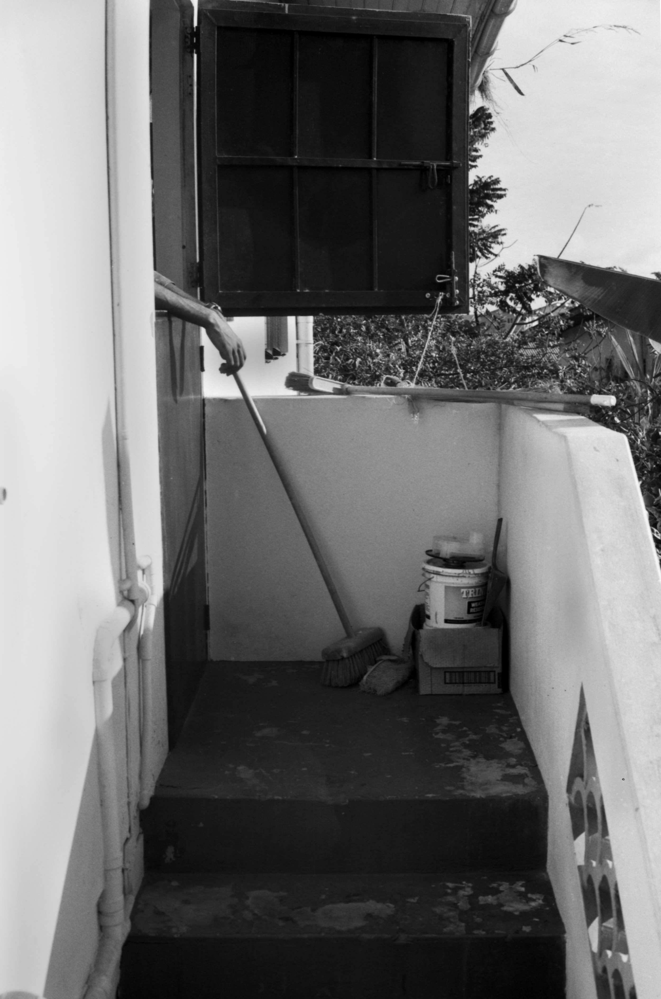 Backdoor at my grandparents house where we stayed. My brothers hands.