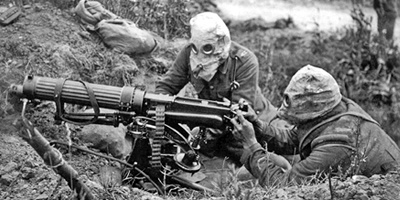 WWI machine gun crew wearing gas masks