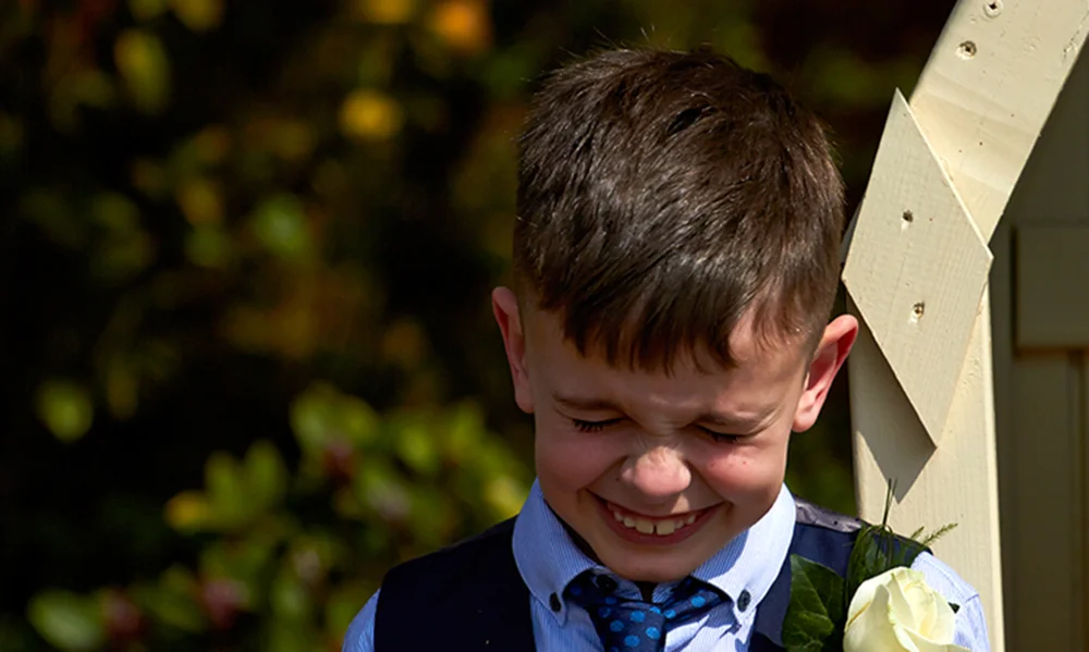 Group wedding photos are important, but so is getting the little cheeky moments