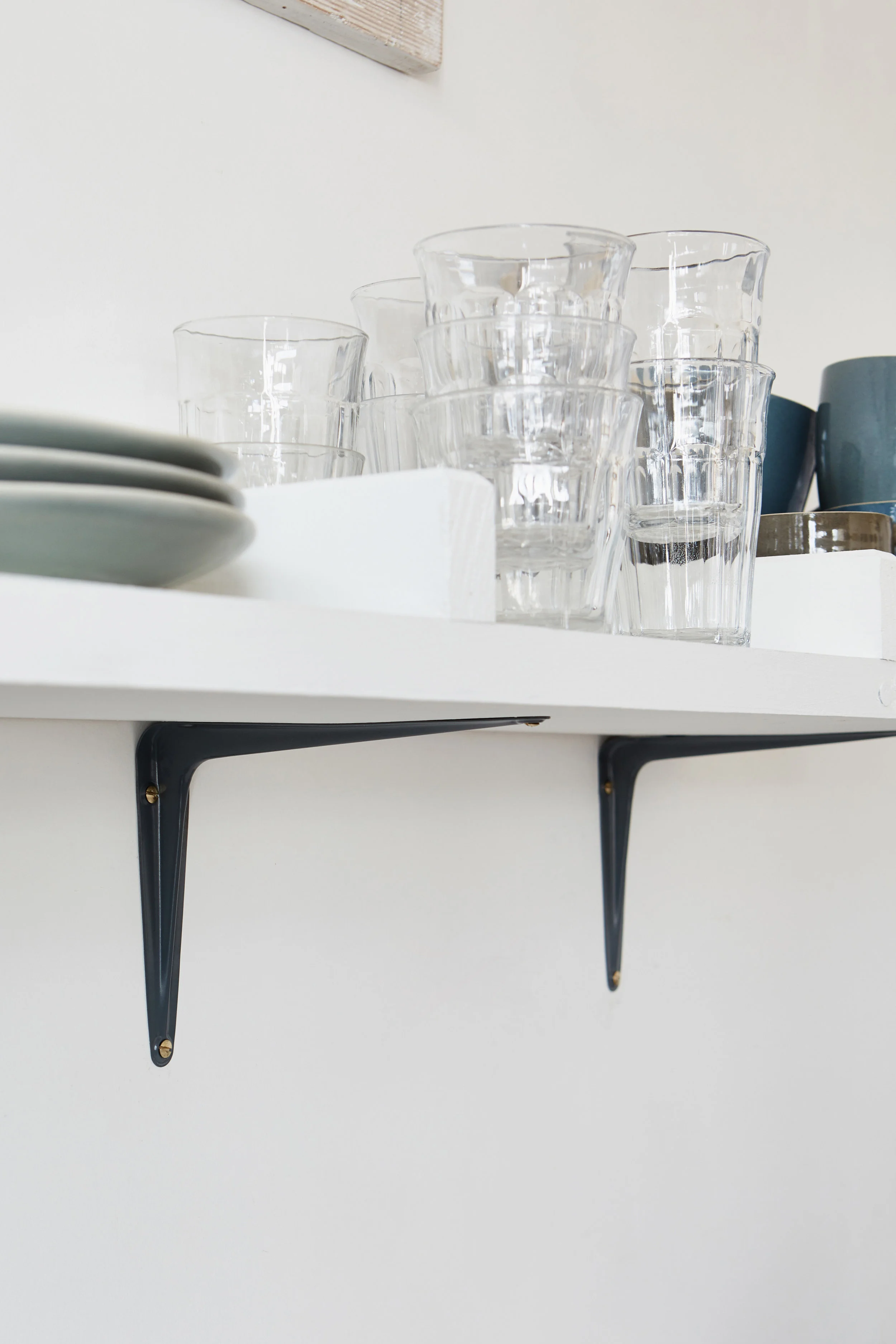 Grey metal shelf brackets