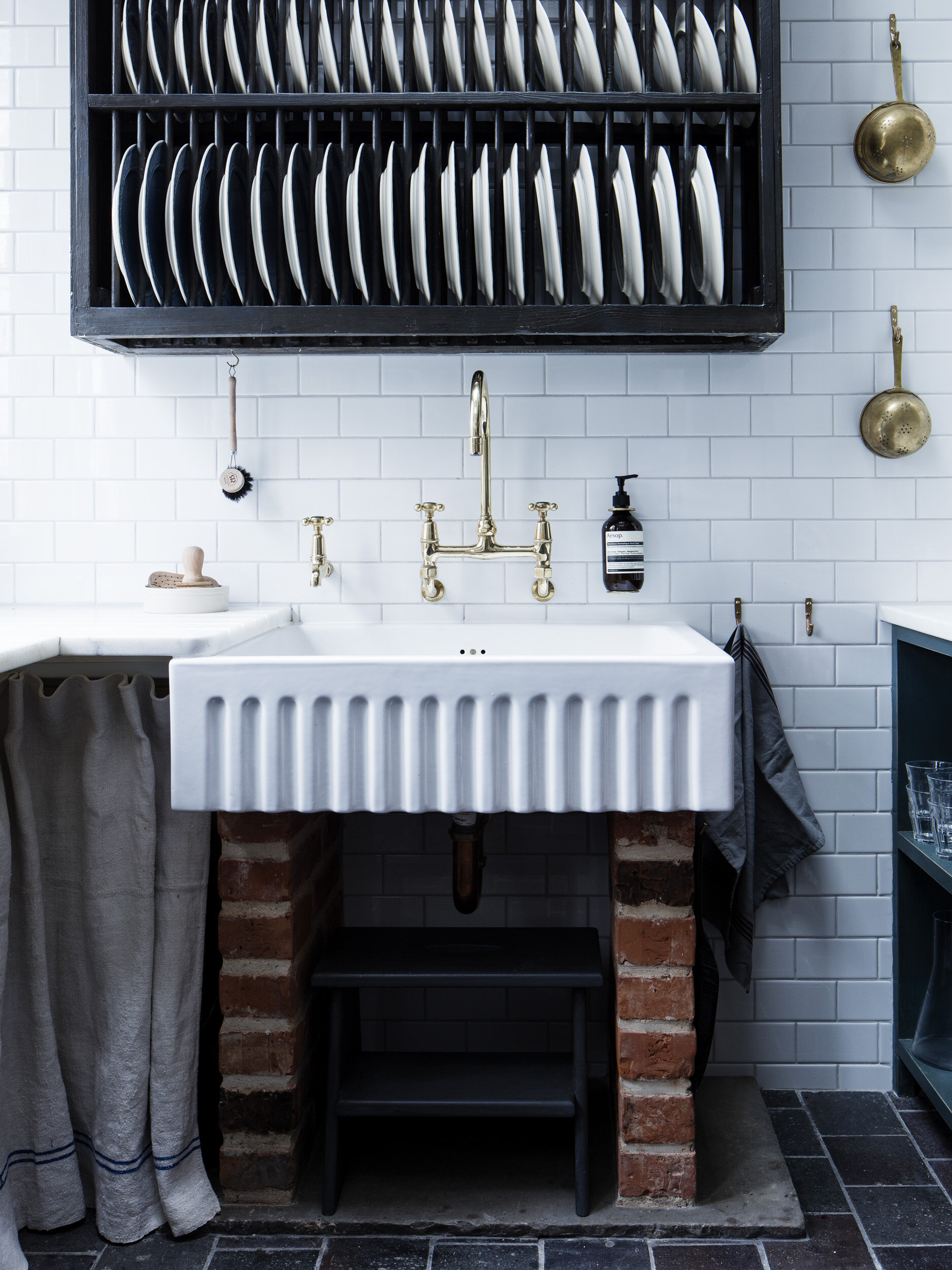 Kitchen sink tidy pot next to sink