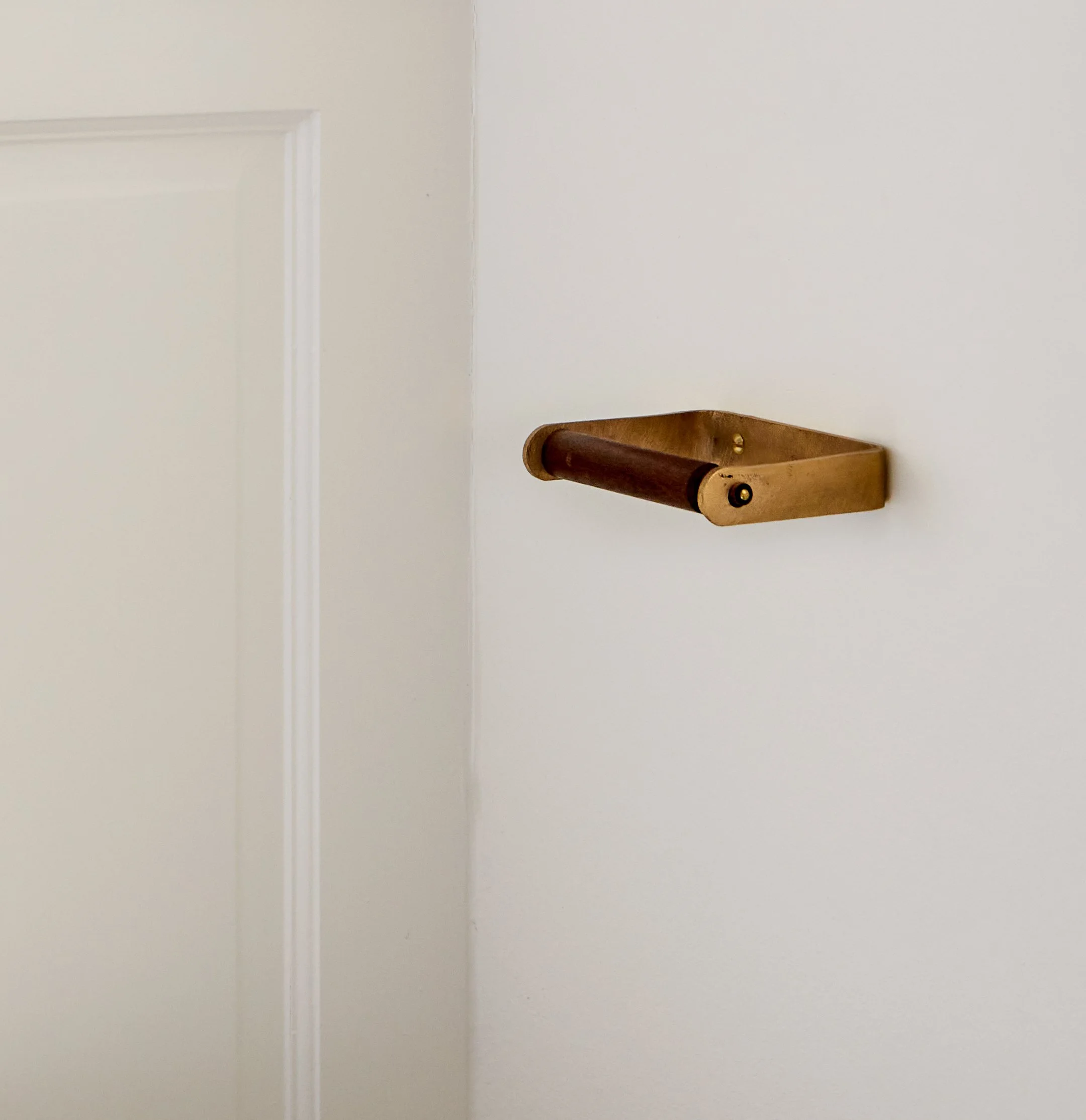 Cast bronze and wooden toilet roll holder
