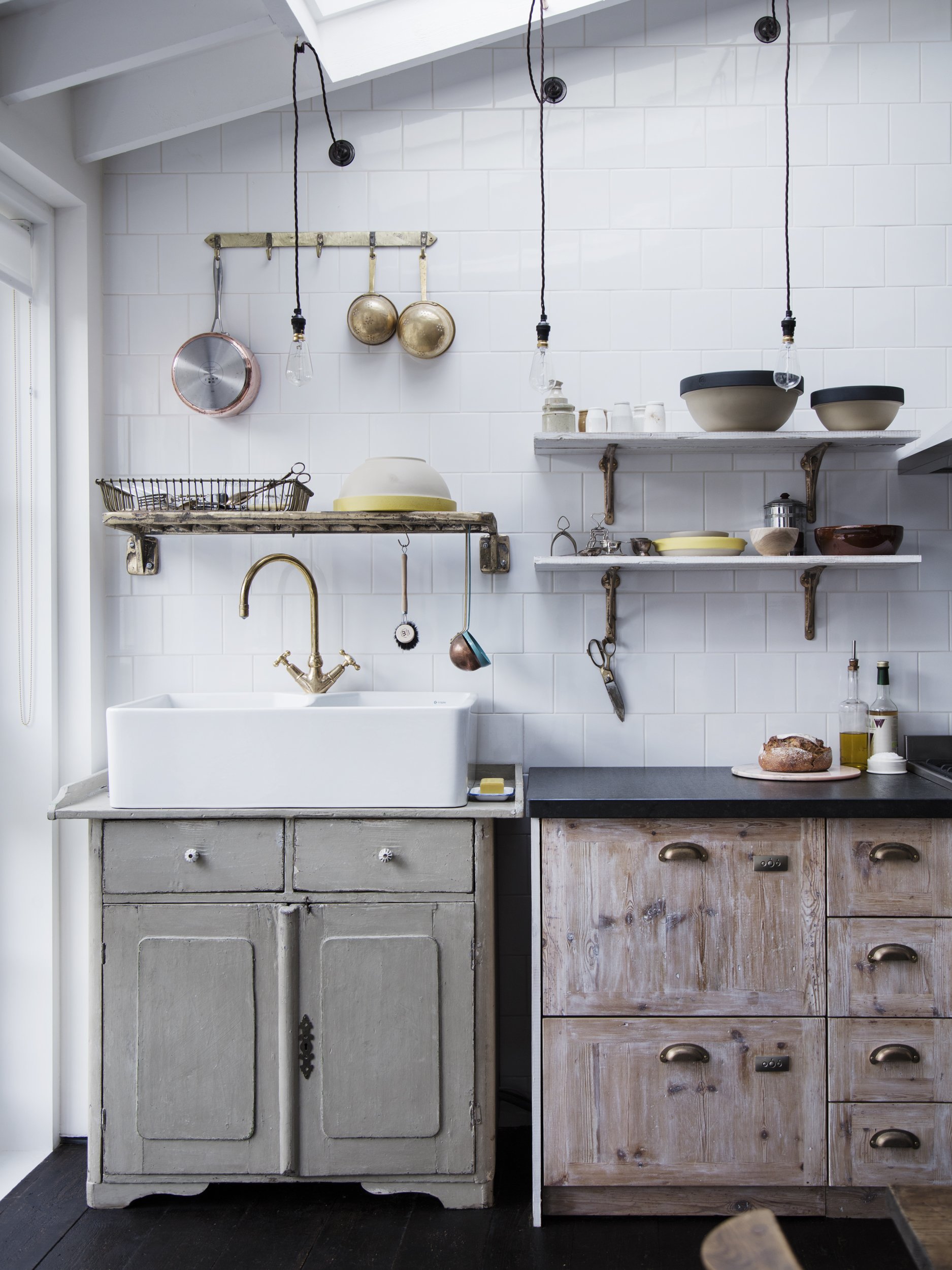kitchen with metal draining rack on wall