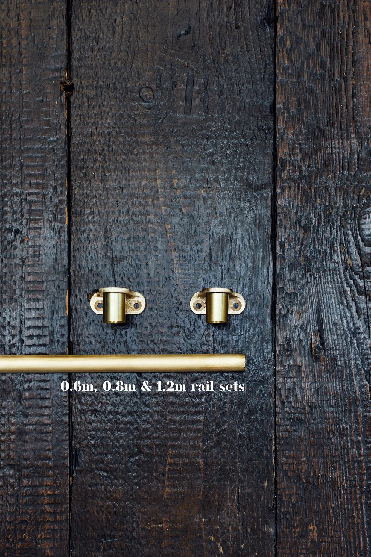 Unlacquered Brass Café Curtain Rail Set Cafe end brackets x 2 and 1 x section of rail, laid out on timber board Text is added to the photo with 0.6m, 0.8m & 1.2m rail sets