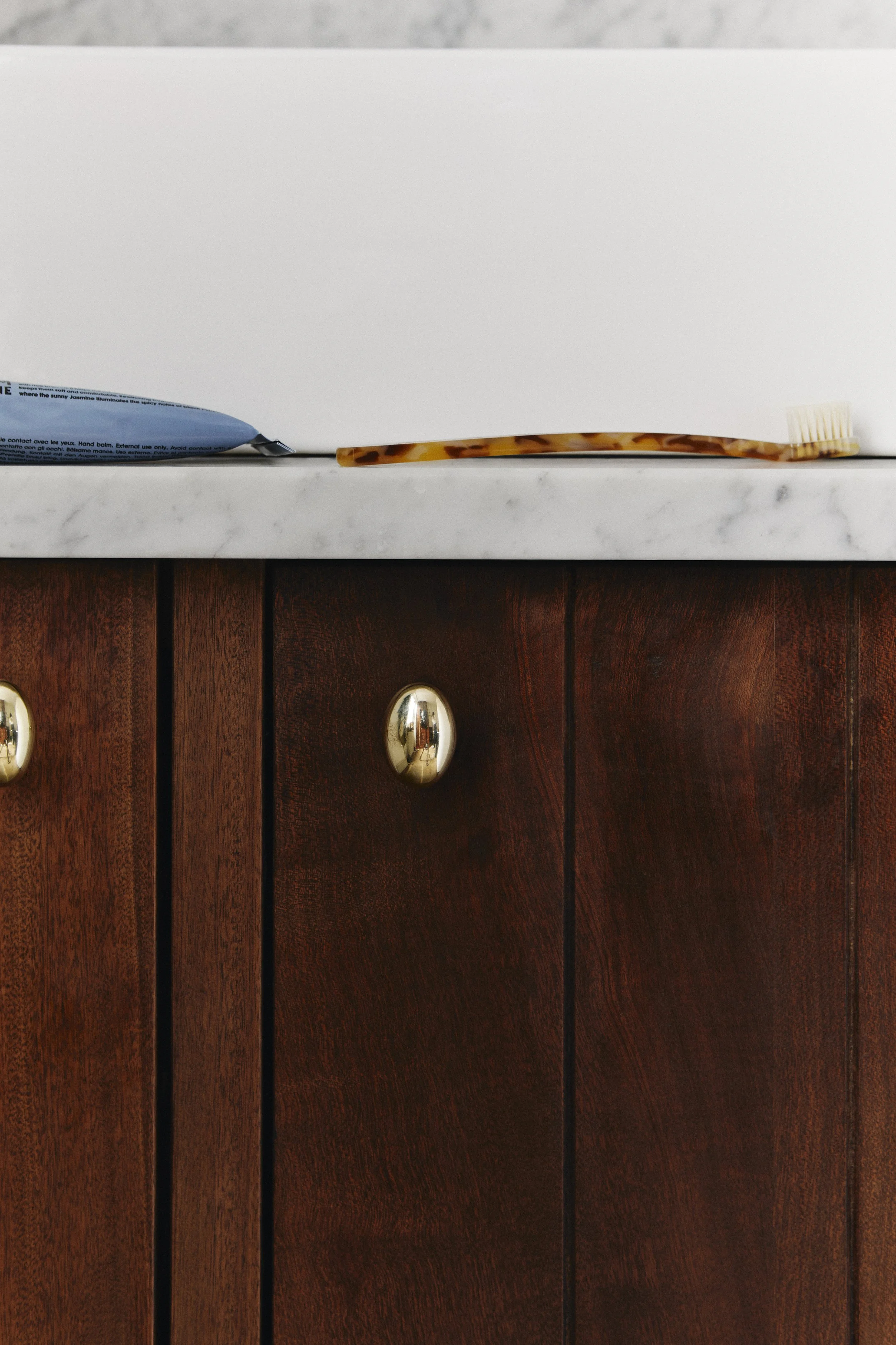 oval-knob-polished-brass-cabinet-hardware.jpg