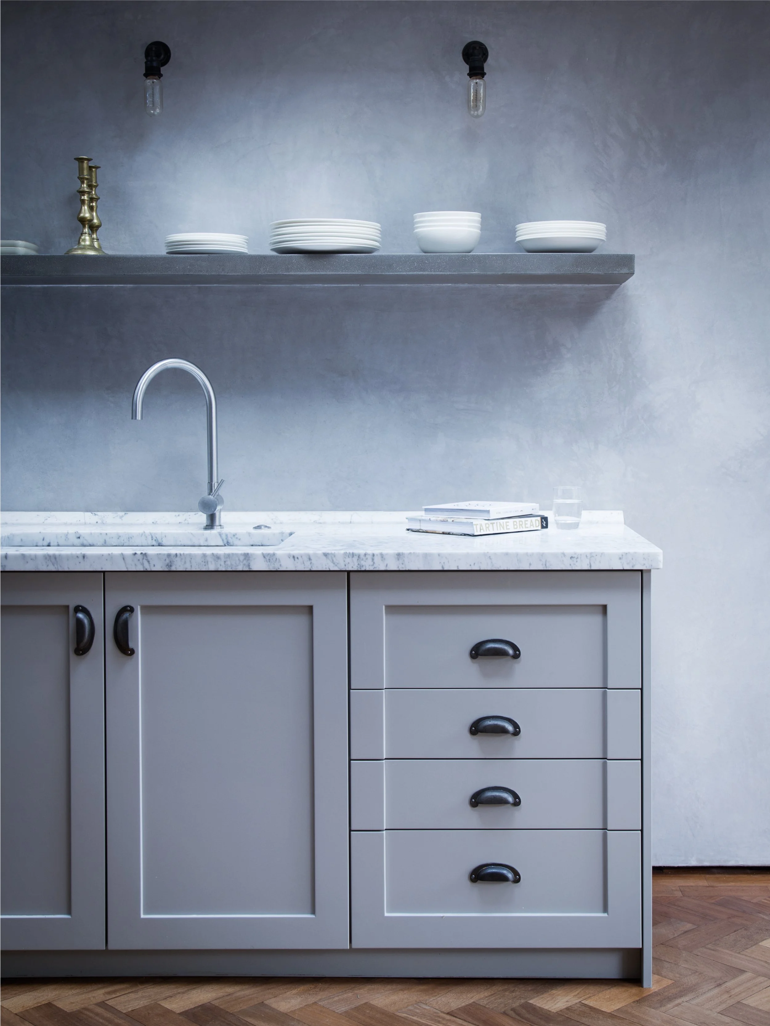 Floating concrete shelf and kitchen cupboards