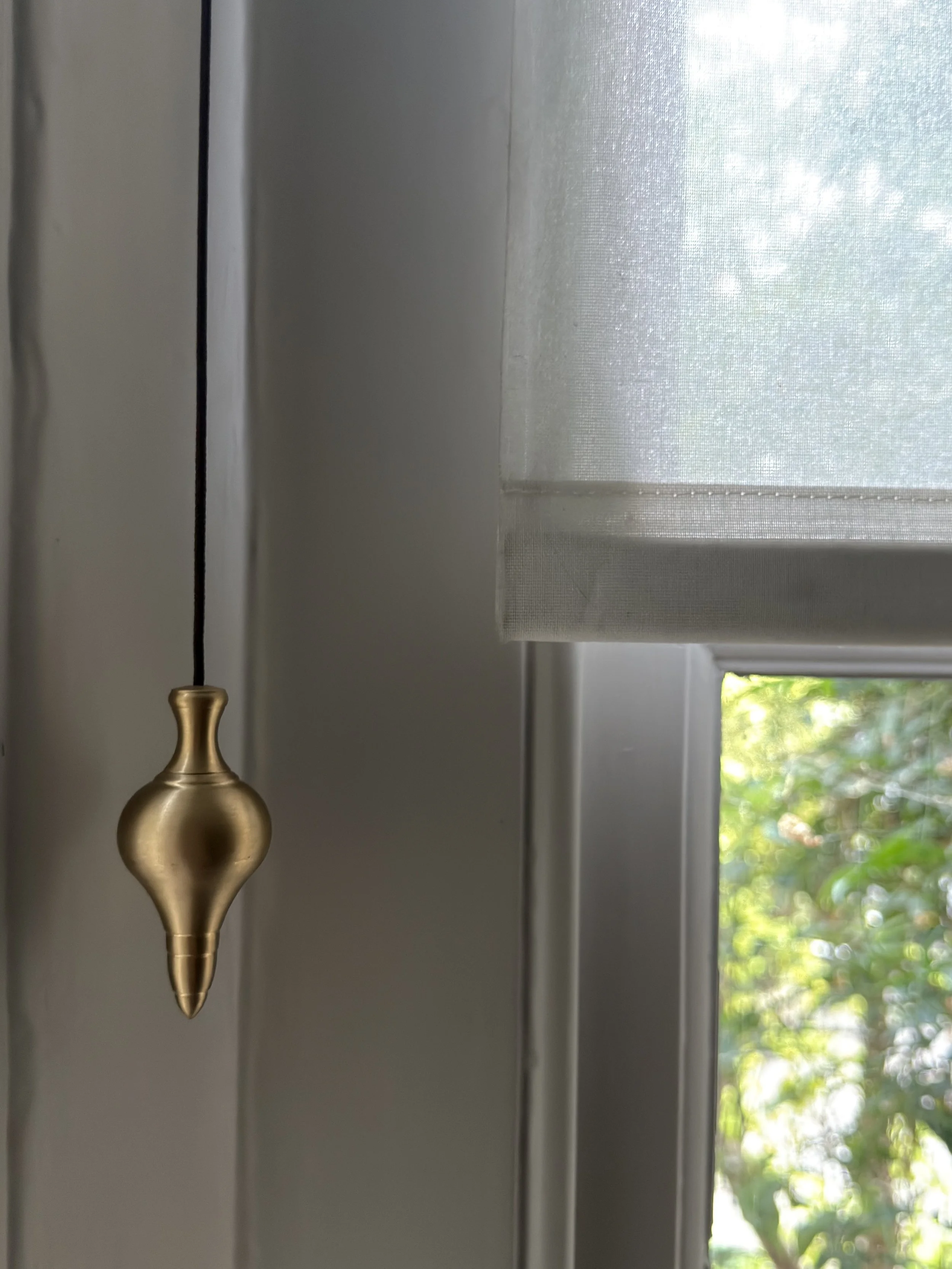 unlacquered-brass-cord-weight-on-window-blind-detail.jpg