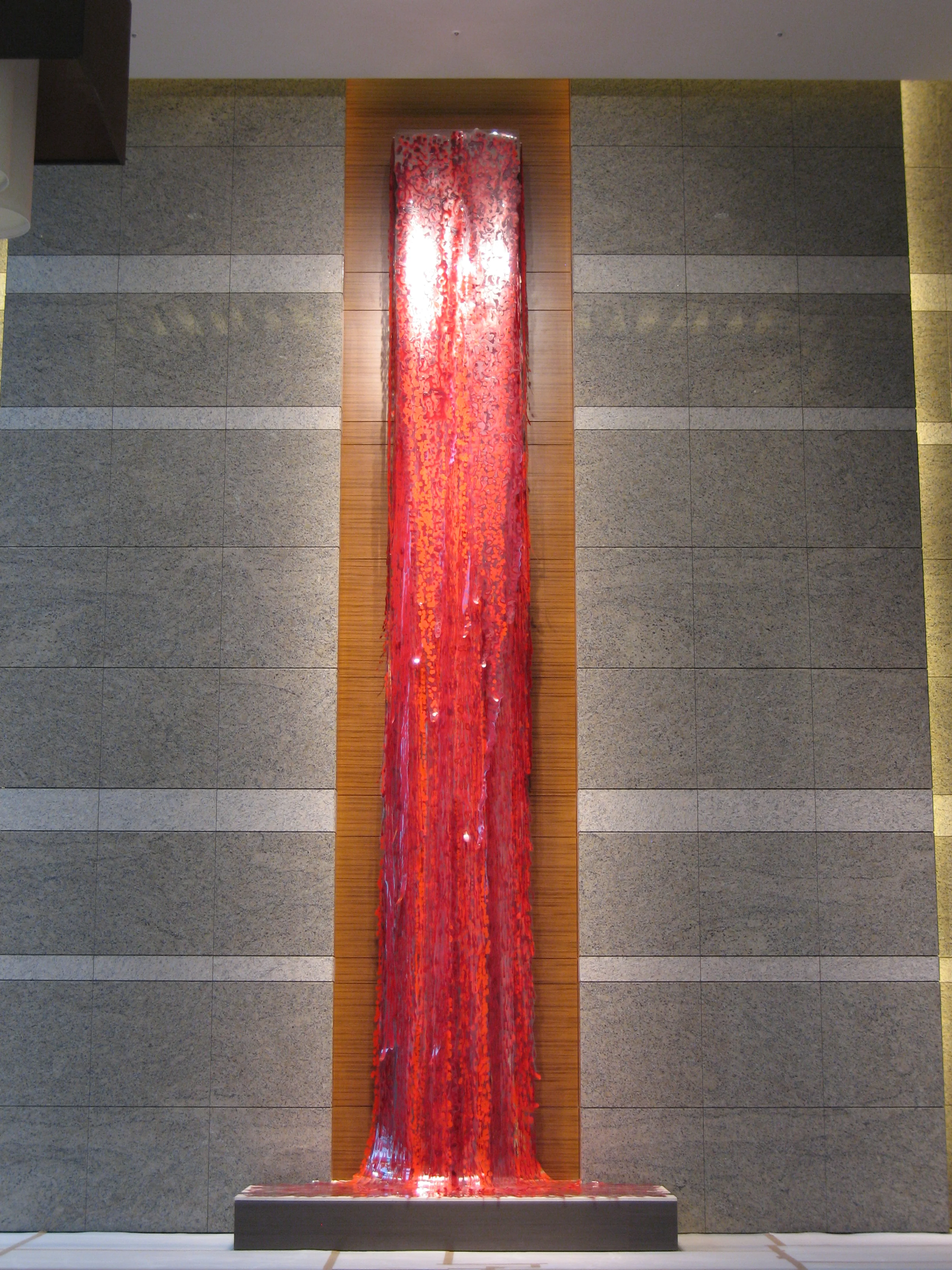Twin Falls Two monumental falls mirror one another in the north and south reception halls of a private residential complex. In blood red and cobalt blue, the works allude to origin of life and the energy of life. Twin Parks, Taichung, Taiwan 23 x 4 x 2 feet, each Acrylic paint on Duralar, mounted to lacquered wooden crown supports 2008 photo credit: Jerry Chinn