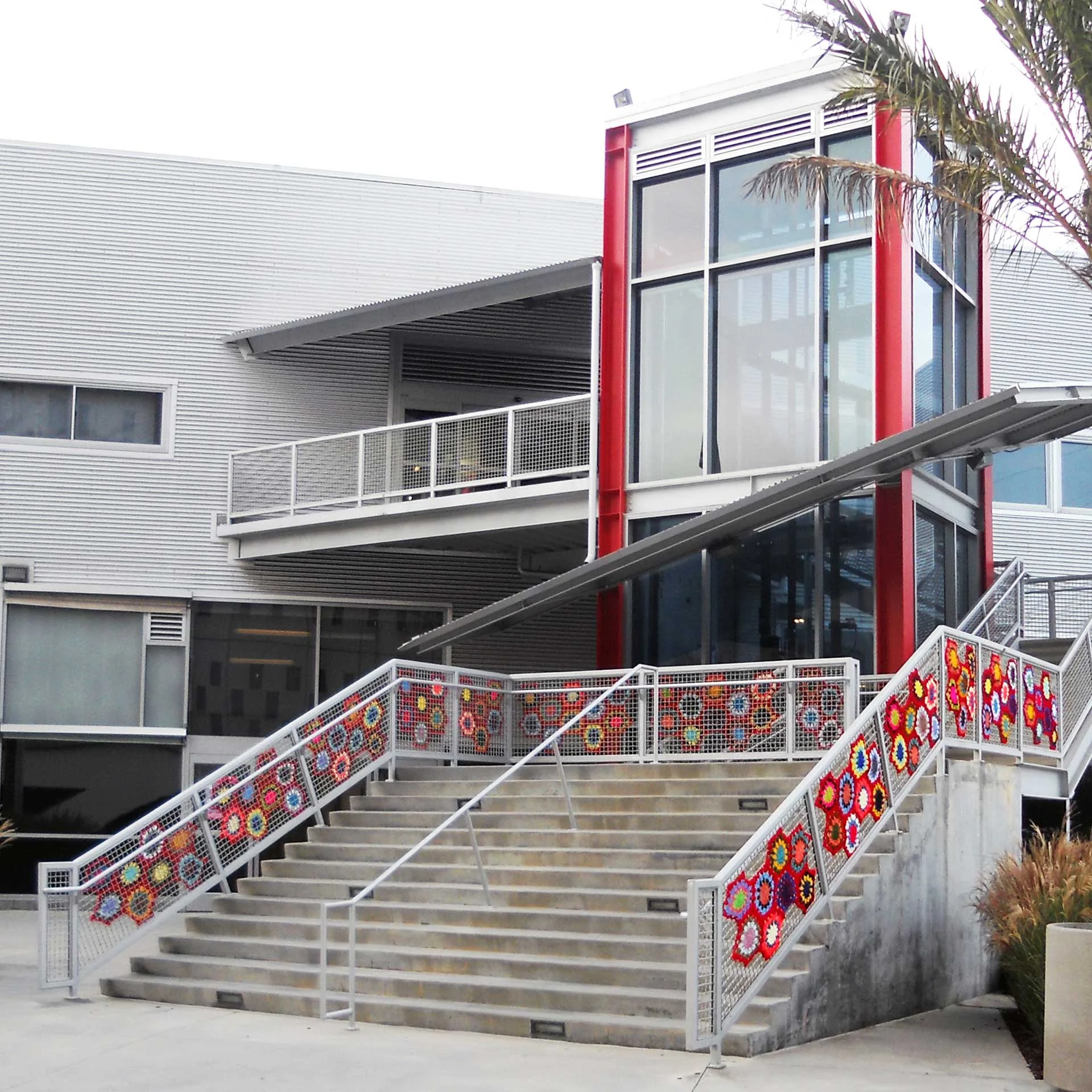 100 Colors, 2018, 33" h x 502" w x 1/2" d, Urban Intervention in Crocheted Acrylic, a special installation in conjunction with 100 Projects, Otis College of Art and Design, Los Angeles, CA. 100 Colors is a site-specific installation of knitted and crocheted yarns representing each of the 100 years of Otis College of Art and Design. Donated ‘granny stash’ and current yarns celebrate the contributions of Otis College alumni and current students to the greater creative community. 100 Colors is a site-specific installation of crocheted yarns representing each of the 100 years of Otis College of Art and Design. Donated 'granny stash' and current yarns celebrate the contributions of Otis College alumni and current students to the greater creative community.