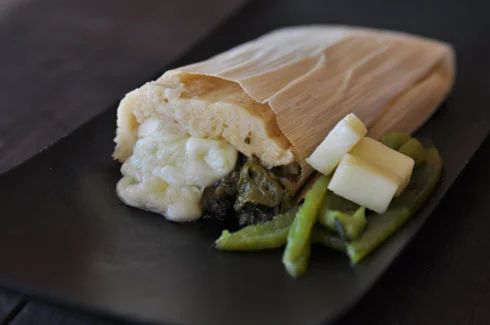 HATCH GREEN CHILE & MONTEREY JACK CHEESE - This delicious and moderately spicy tamale includes roasted HATCH chiles and a gooey monterey jack cheese center.