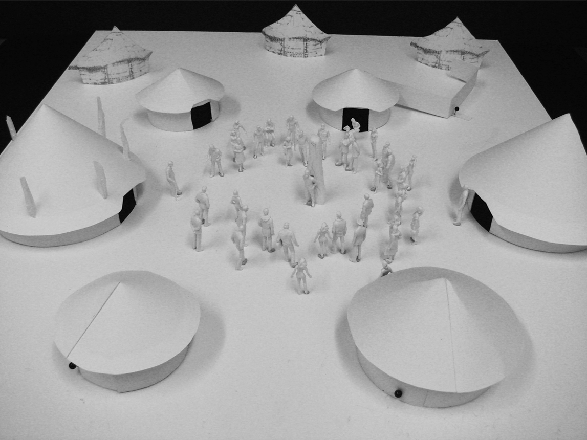 Model showing layout of the round houses along with three cut-out background huts.