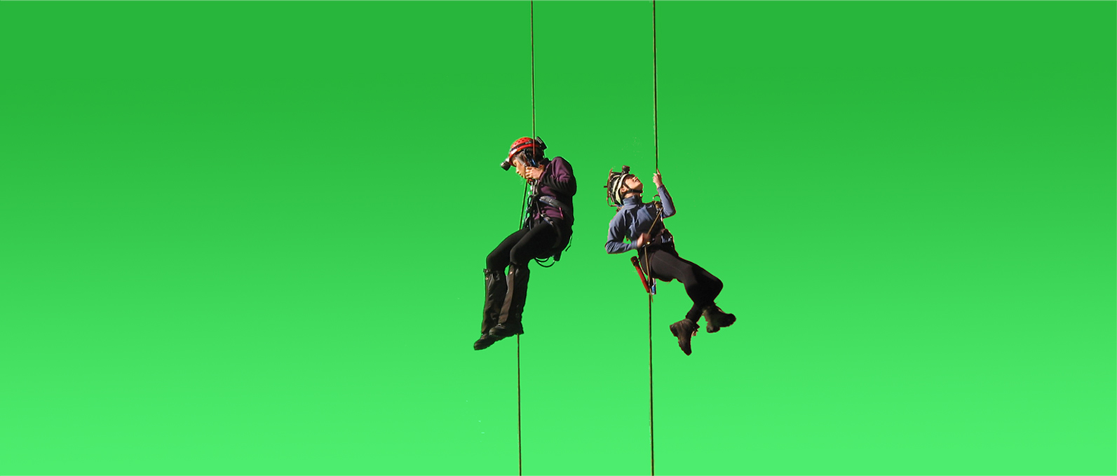 The actresses were shot against green screen as if abseiling down into the cave but actually filmed without being lowered. This footage was then added to the model background plate with the characters descending.