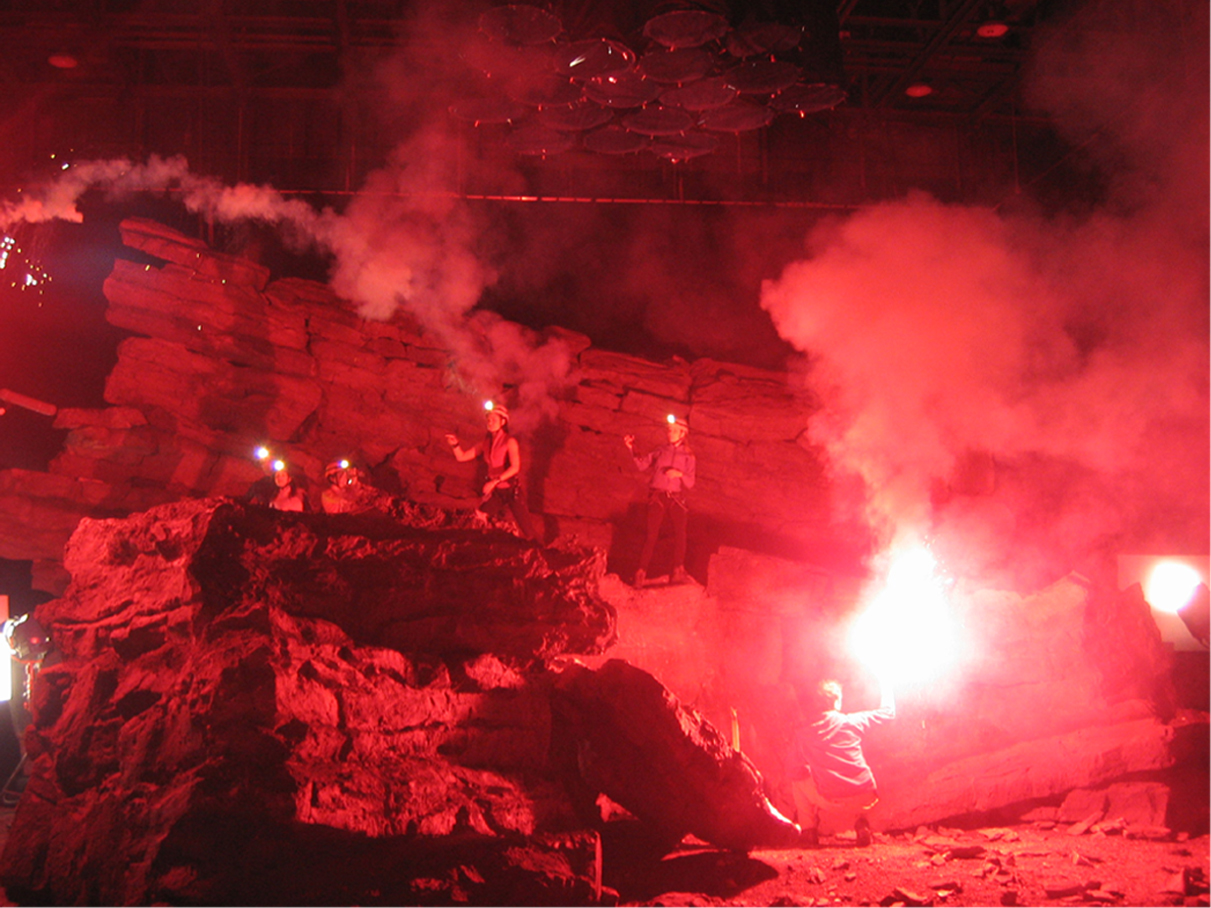 50ft square 20ft high Cathedral Chamber set lit with red flares.