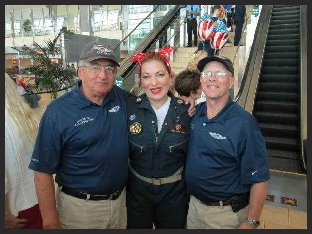 Col. John Telles (Ret), Rich Kenney, and Air Group One's own "Rosie the Riveter" Torri Mowery