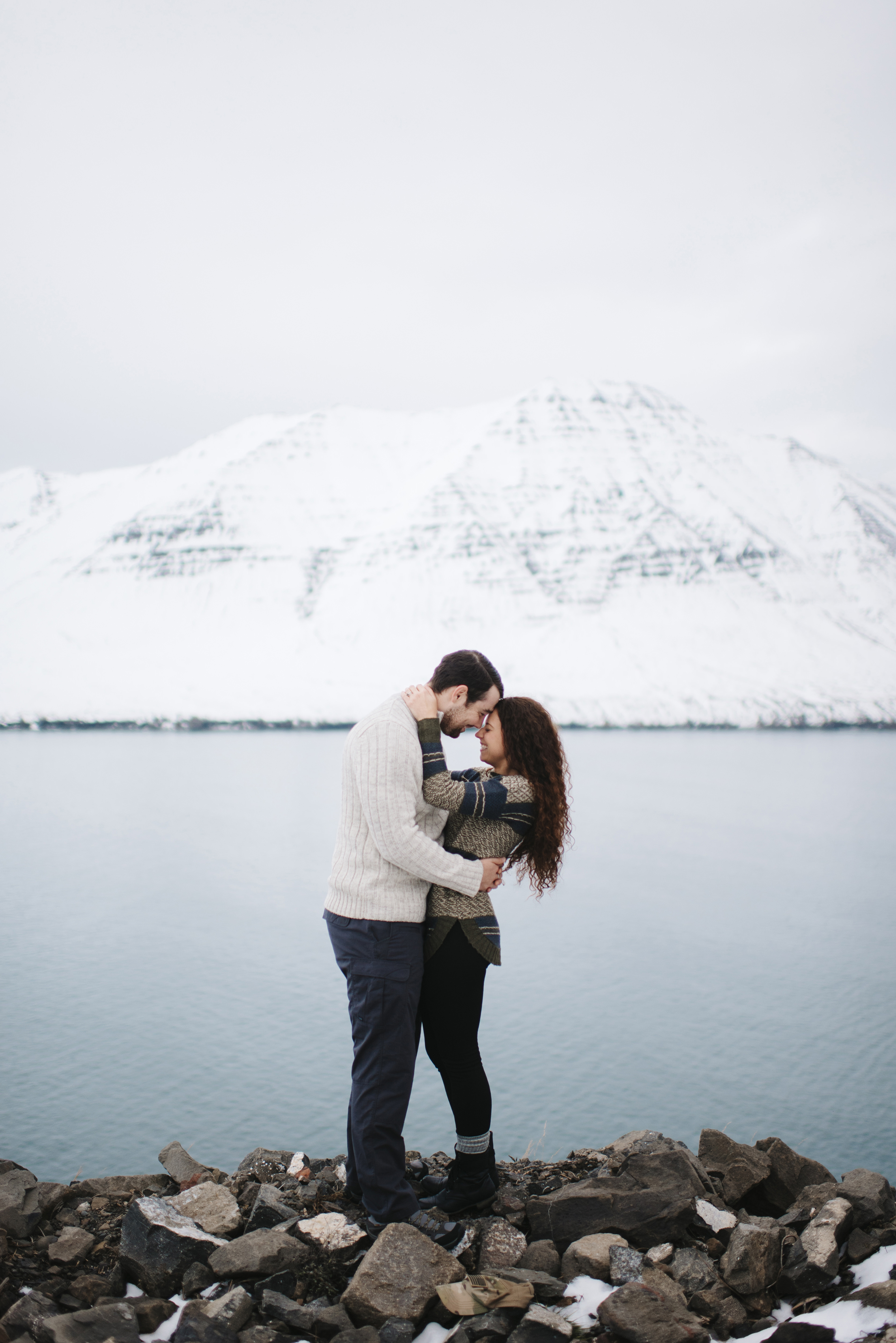 Laughing couple in Fjords of Northeastern Iceland during Honeymoon Photography Session by Iceland Elopement Photographer Colby and Jess colbyandjess.com