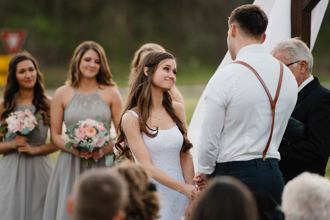 A bride looks lovingly at her groom during their Buffalo River Wedding by Arkansas Adventure Destination Photographer Colby and Jess