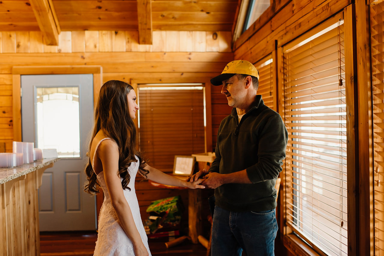 A bride's father sees her in her dress for the first time the morning of her Outdoor Ozarks Wedding by Buffalo River Adventure Elopement Photographers Colby and Jess