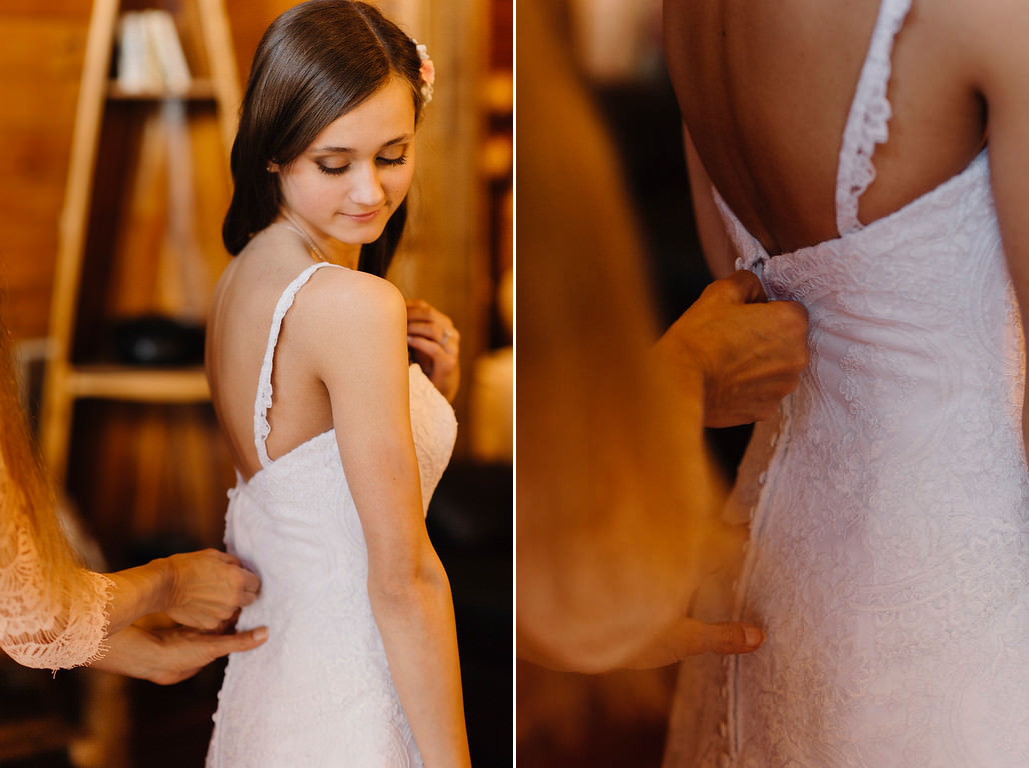 A bride has her dress zipped up in preparation for her Outdoor Buffalo River Wedding by Ozarks Adventure Elopement Photographers Colby and Jess