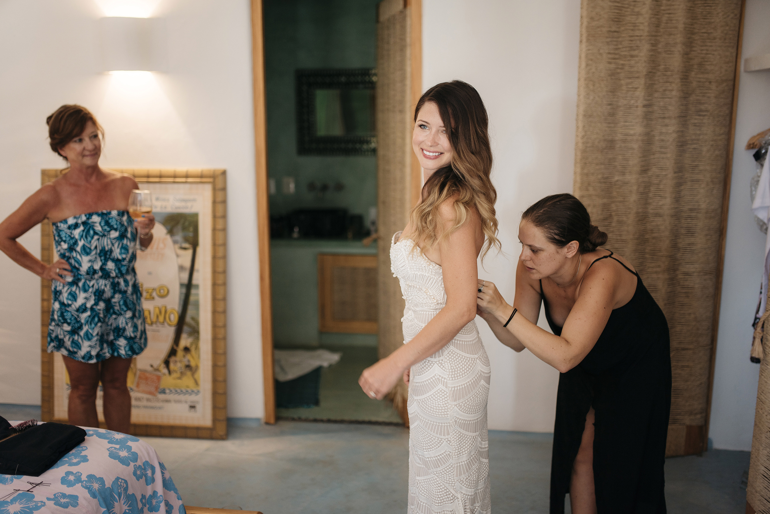Bride gets dressed for Sayulita Beach Wedding photography by Mexico Destination Elopement Photographer Colby and Jess colbyandjess.com