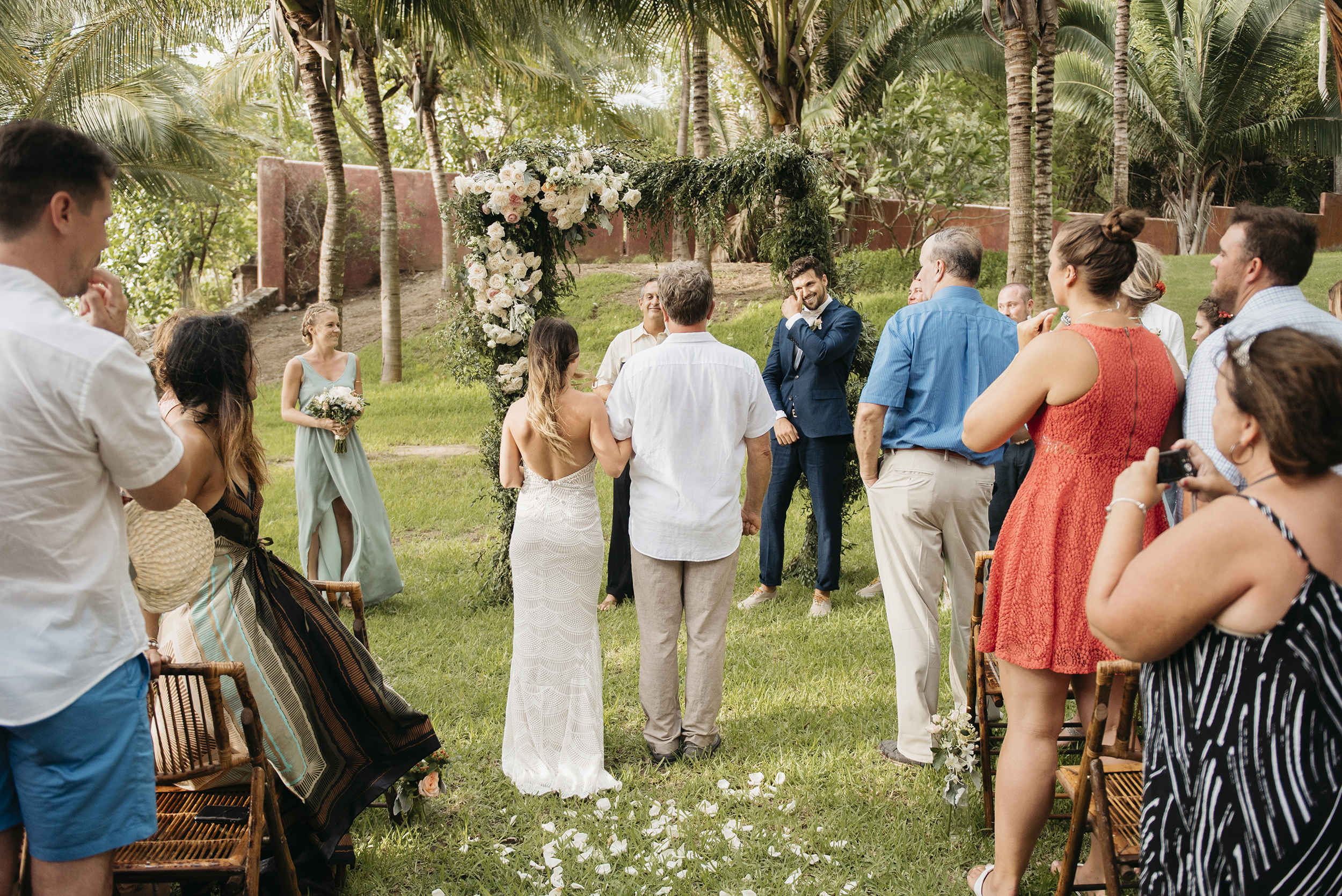 Groom tears up as he sees bride during Sayulita Wedding ceremony photography by Mexico Destination Elopement Photographer Colby and Jess colbyandjess.com