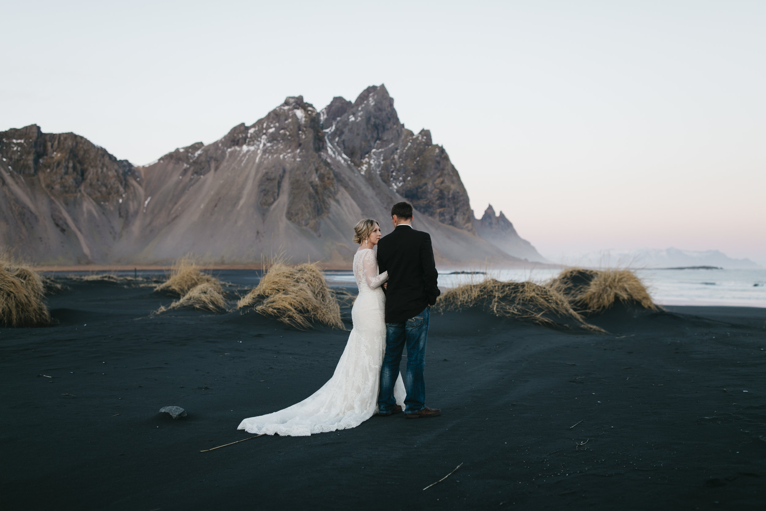 A bride and groom enjoy Vestrahorn during their Iceland Elopement Photography session with Iceland Destination Wedding Photographers Colby and Jess.