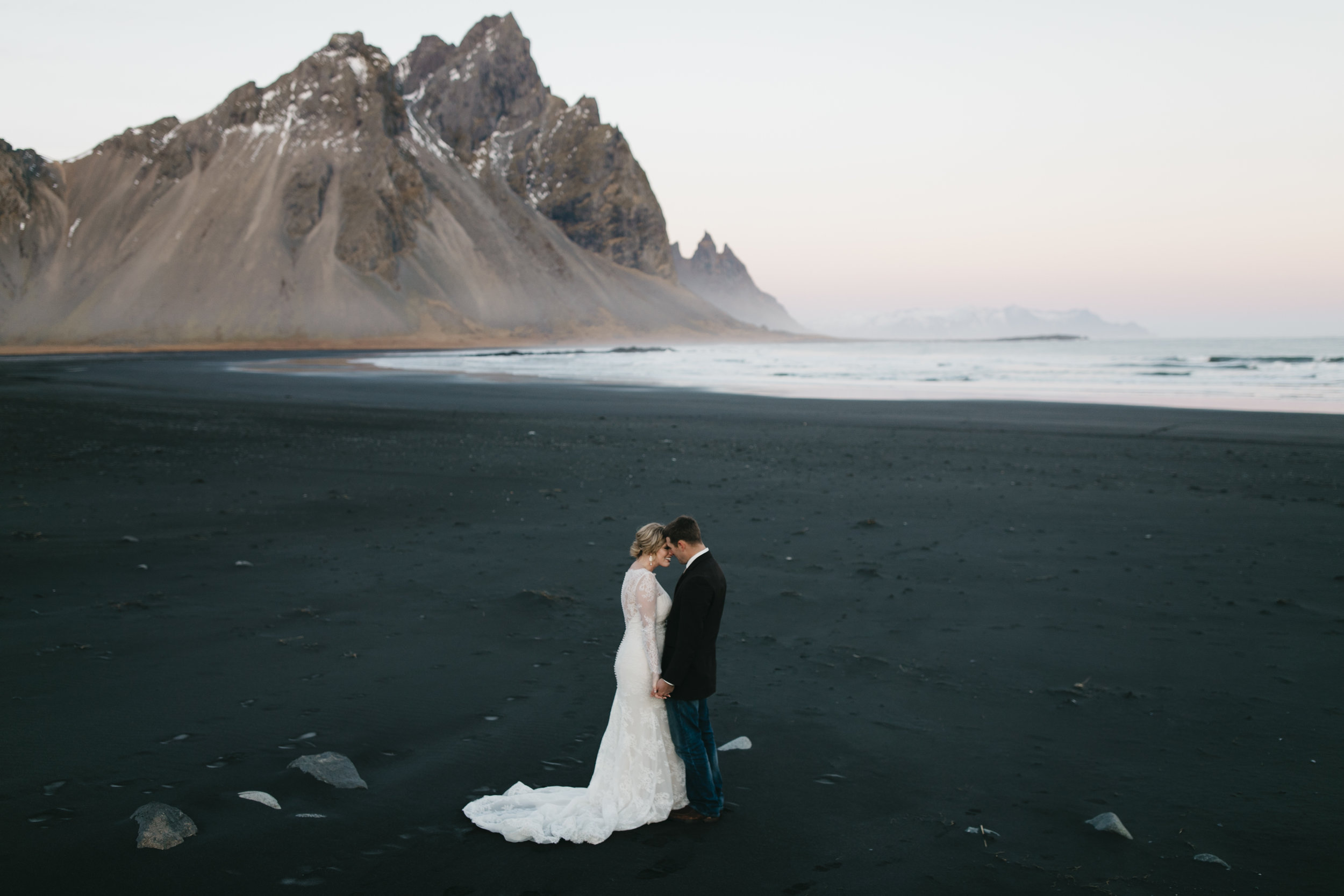 A couple enjoys a quiet moment during their Vestrahorn Iceland Destination Wedding with elopement photographers Colby and Jess.