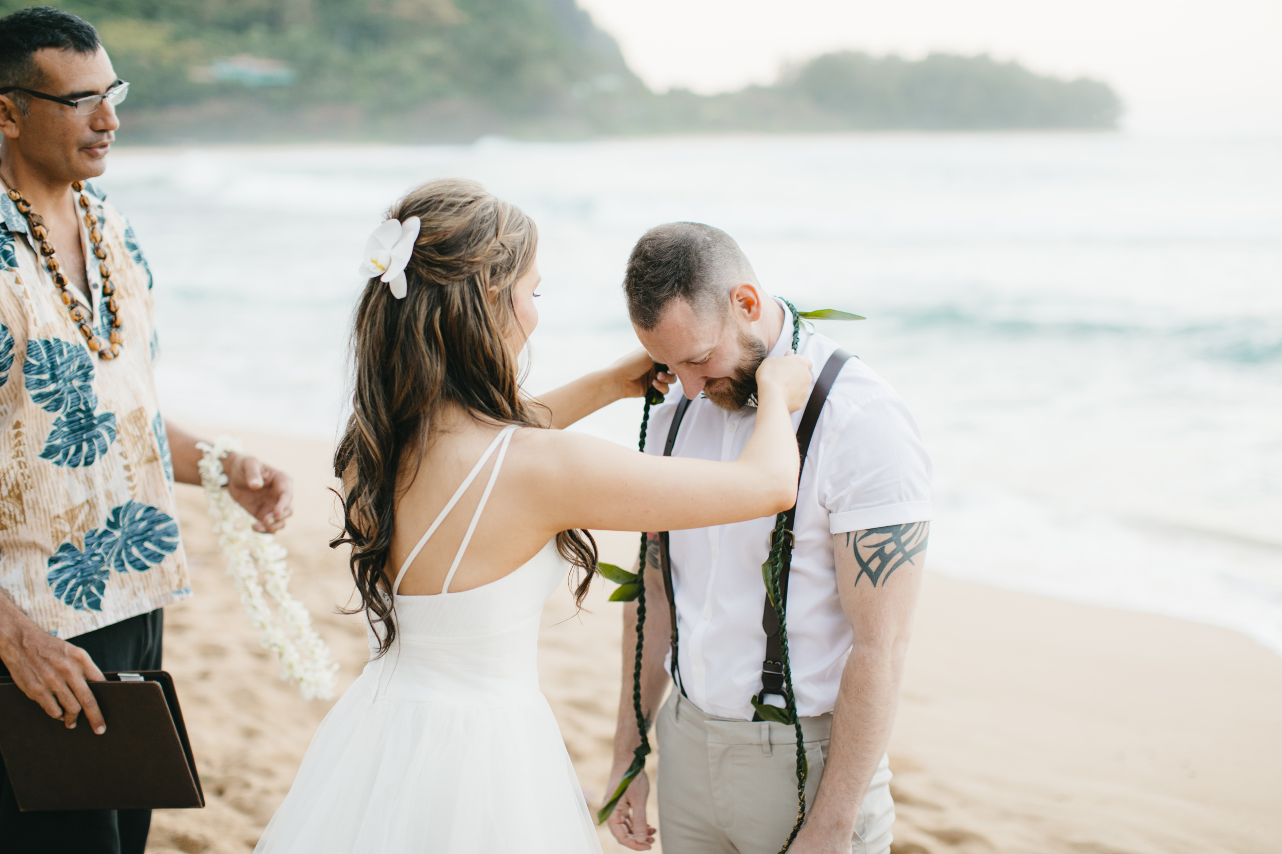 Wedding Ceremony at Tunnels Beach with Kauai Adventure Elopement photographers Colby and Jess