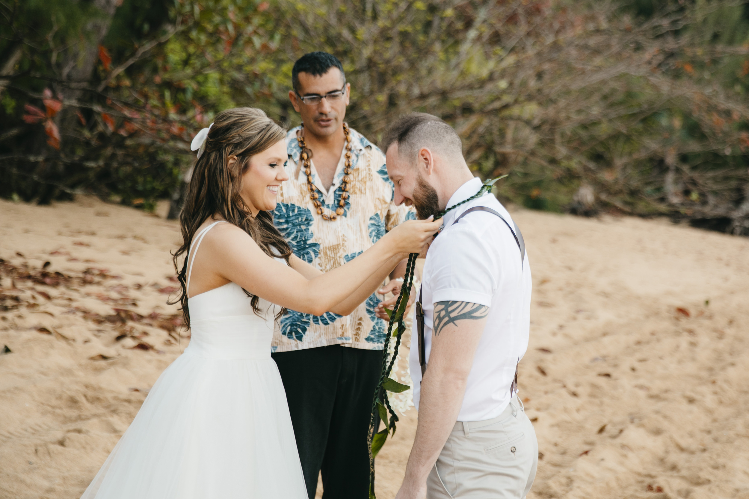 Wedding Ceremony at Tunnels Beach with Kauai Adventure Elopement photographers Colby and Jess