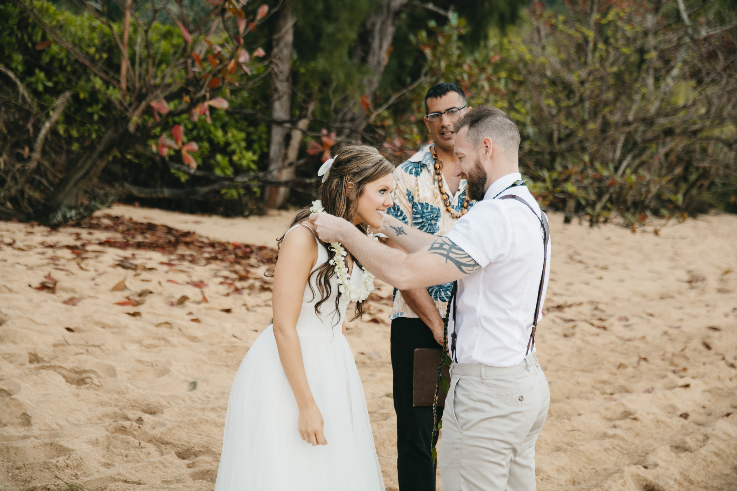 Wedding Ceremony at Tunnels Beach with Kauai Adventure Elopement photographers Colby and Jess