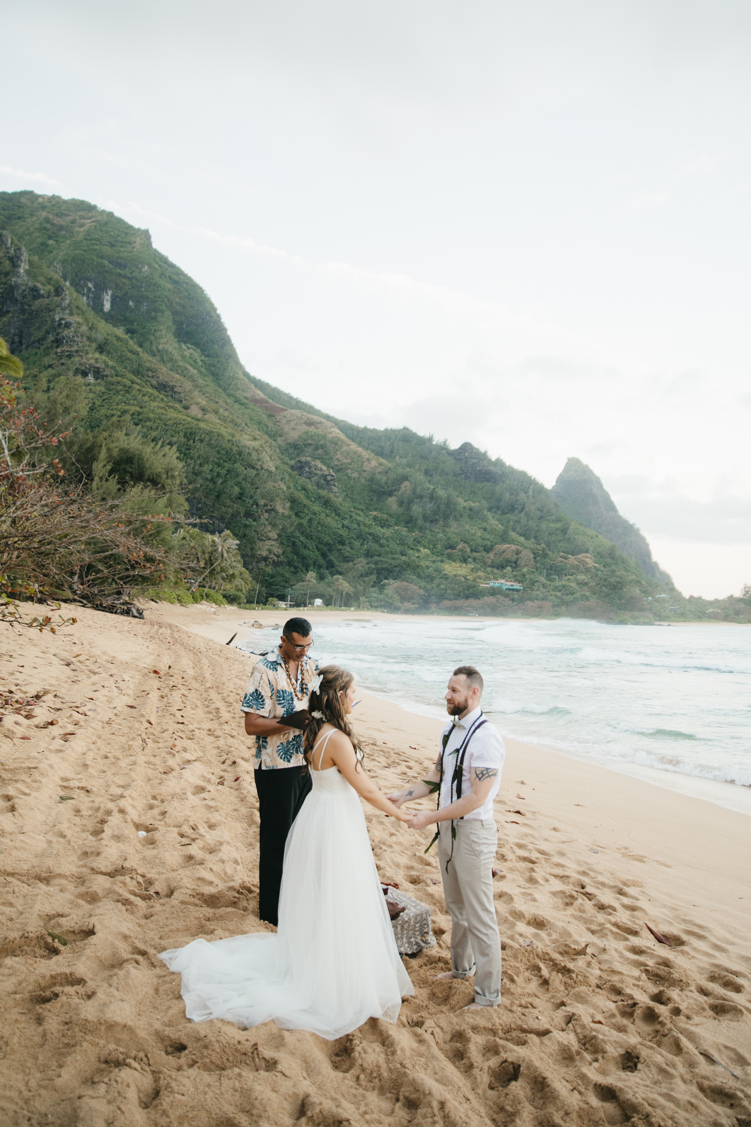 Wedding Ceremony at Tunnels Beach with Kauai Adventure Elopement photographers Colby and Jess