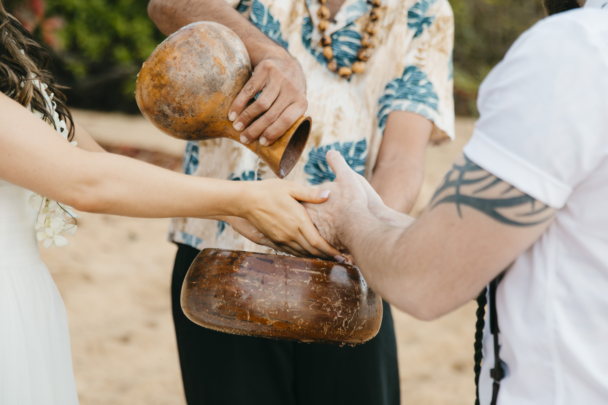 Wedding Ceremony at Tunnels Beach with Kauai Adventure Elopement photographers Colby and Jess