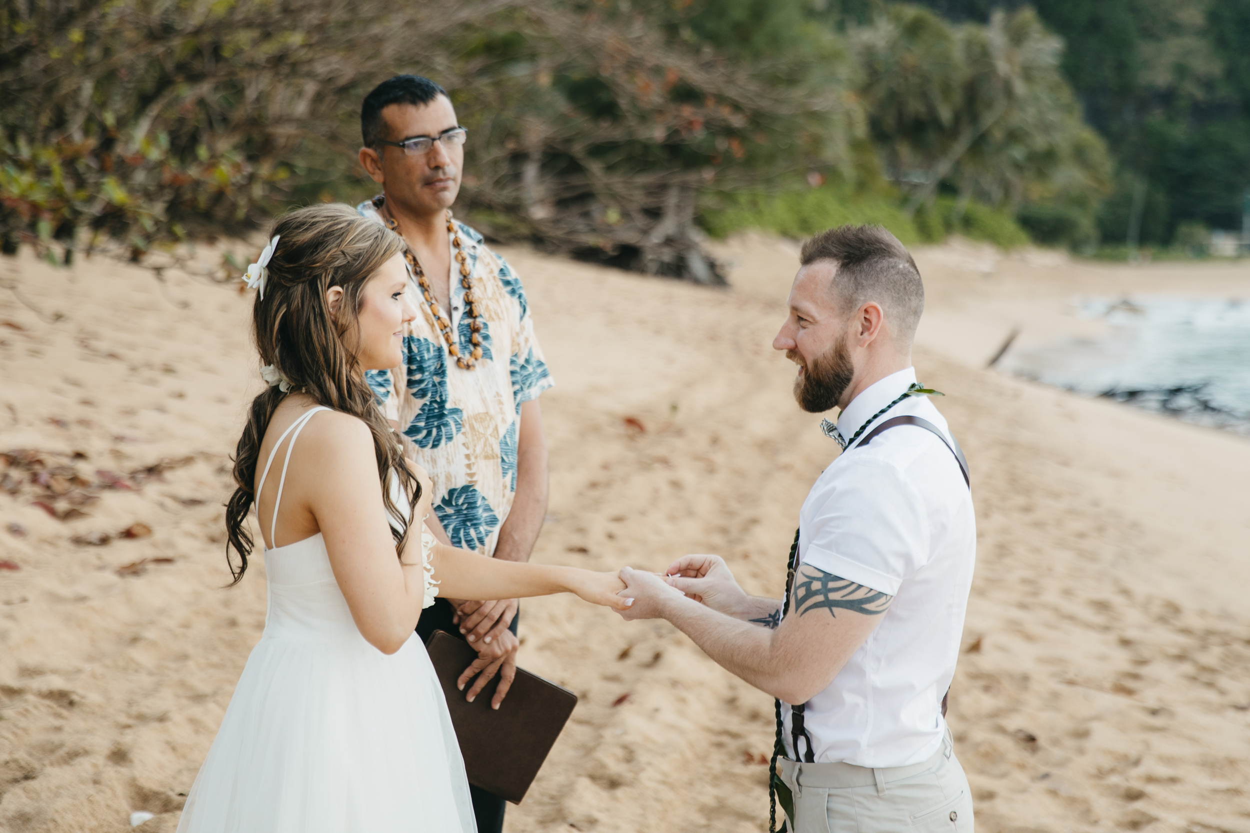 Wedding Ceremony at Tunnels Beach with Kauai Adventure Elopement photographers Colby and Jess