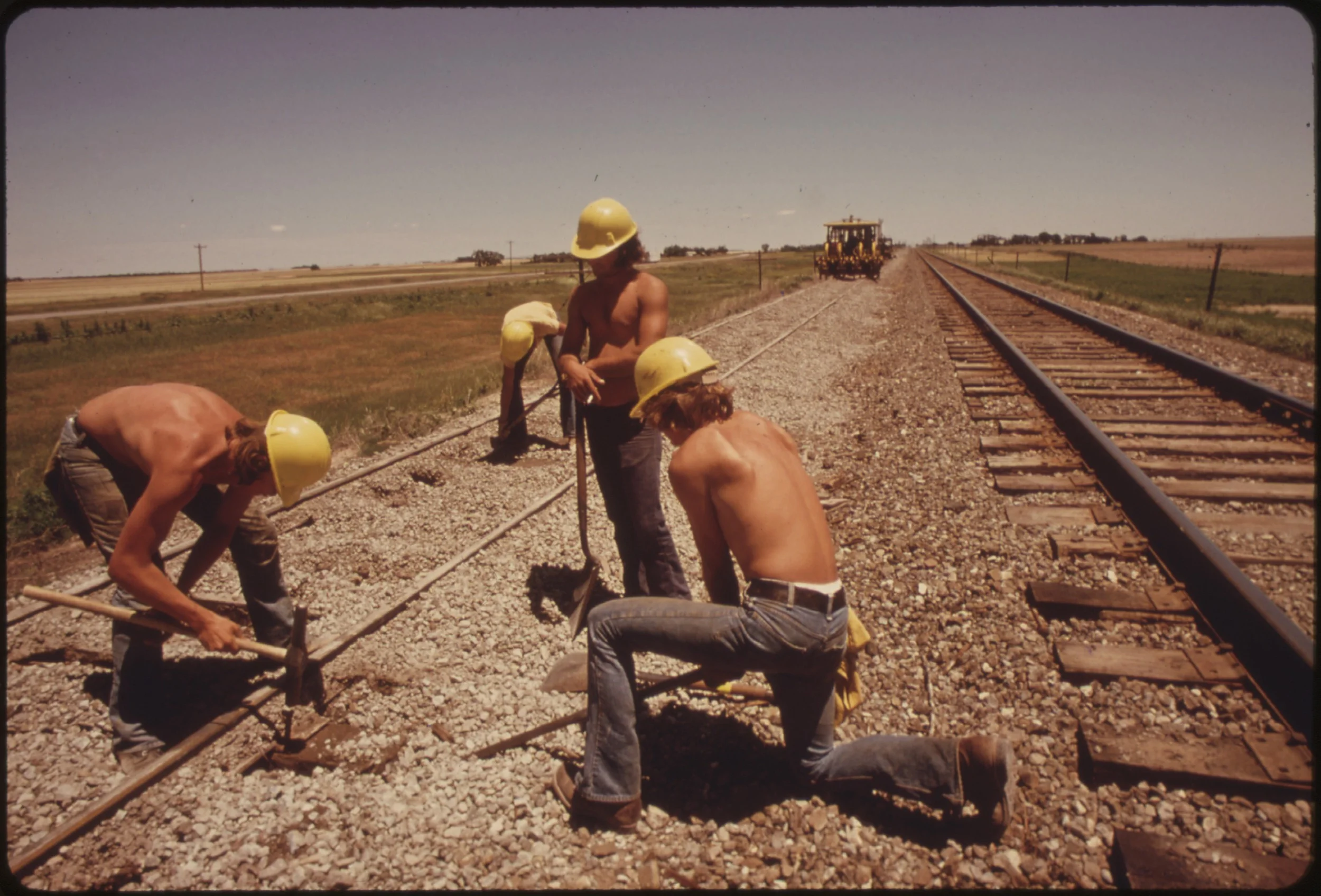 RAILROAD_WORK_CREW_IMPROVES_THE_TRACKS_AND_BED_OF_THE_ATCHISON,_TOPEKA_AND_SANTA_FE_RAILROAD_NEAR_BELLEFONT,_KANSAS..._-_NARA_-_556012.jpg
