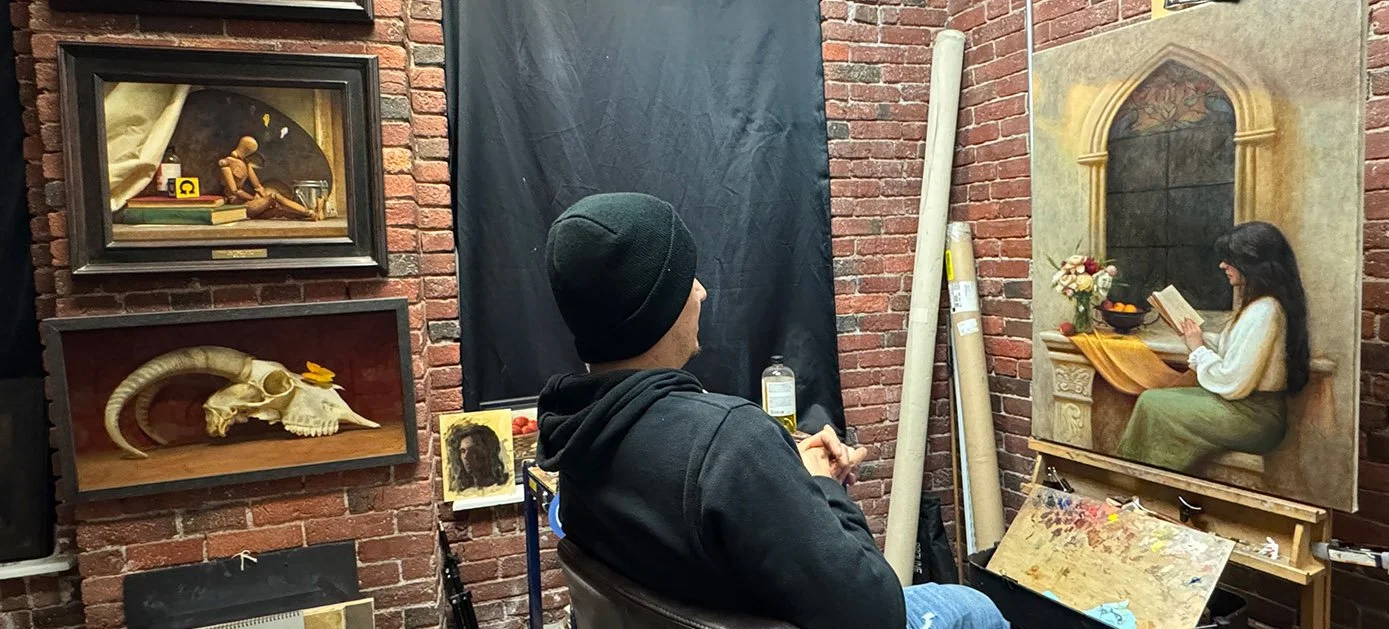 sliders_0006_antonion painting in studio.jpg