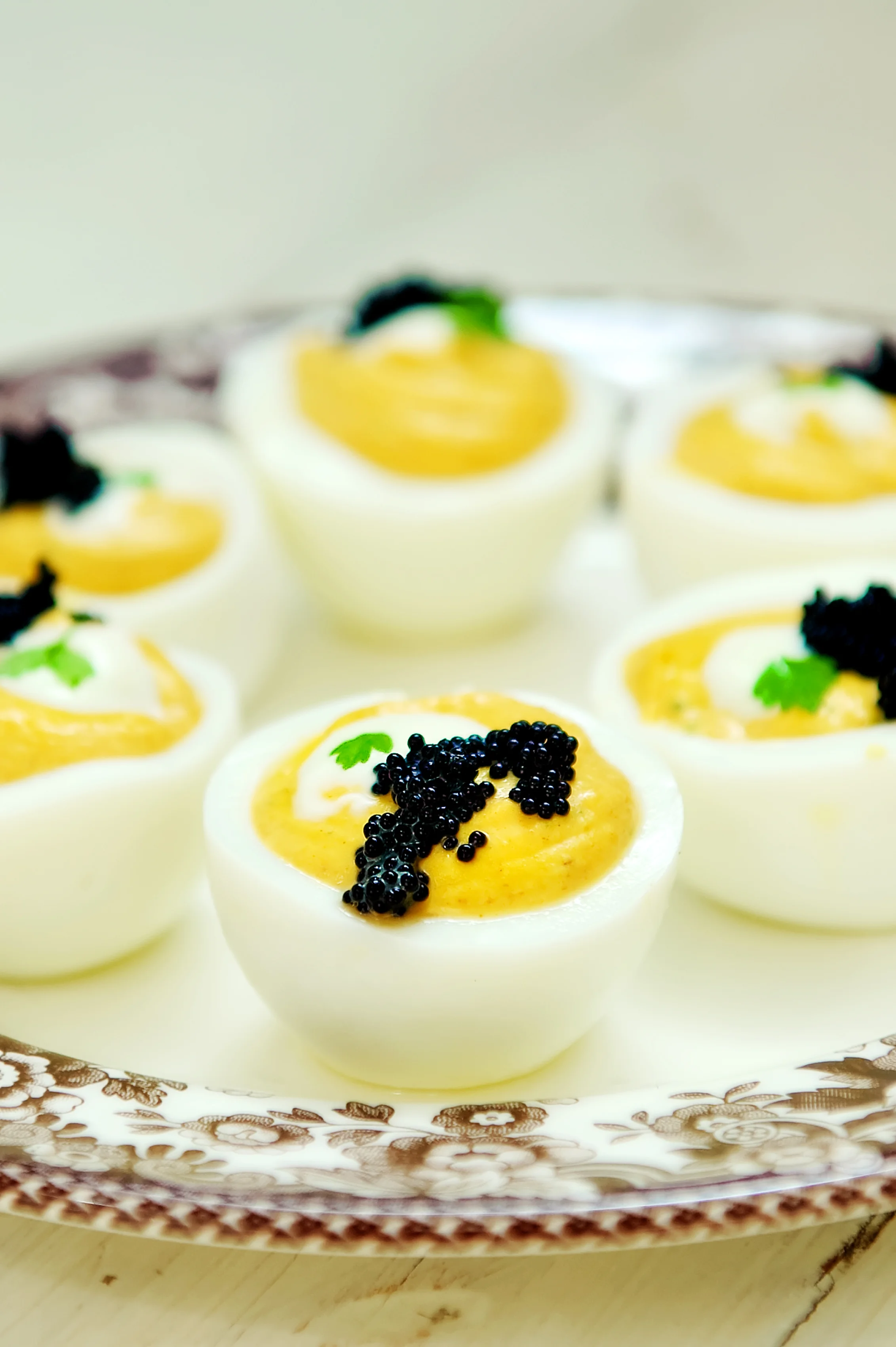 Curry Deviled Eggs, Crème Fraiche, and Tobiko Caviar