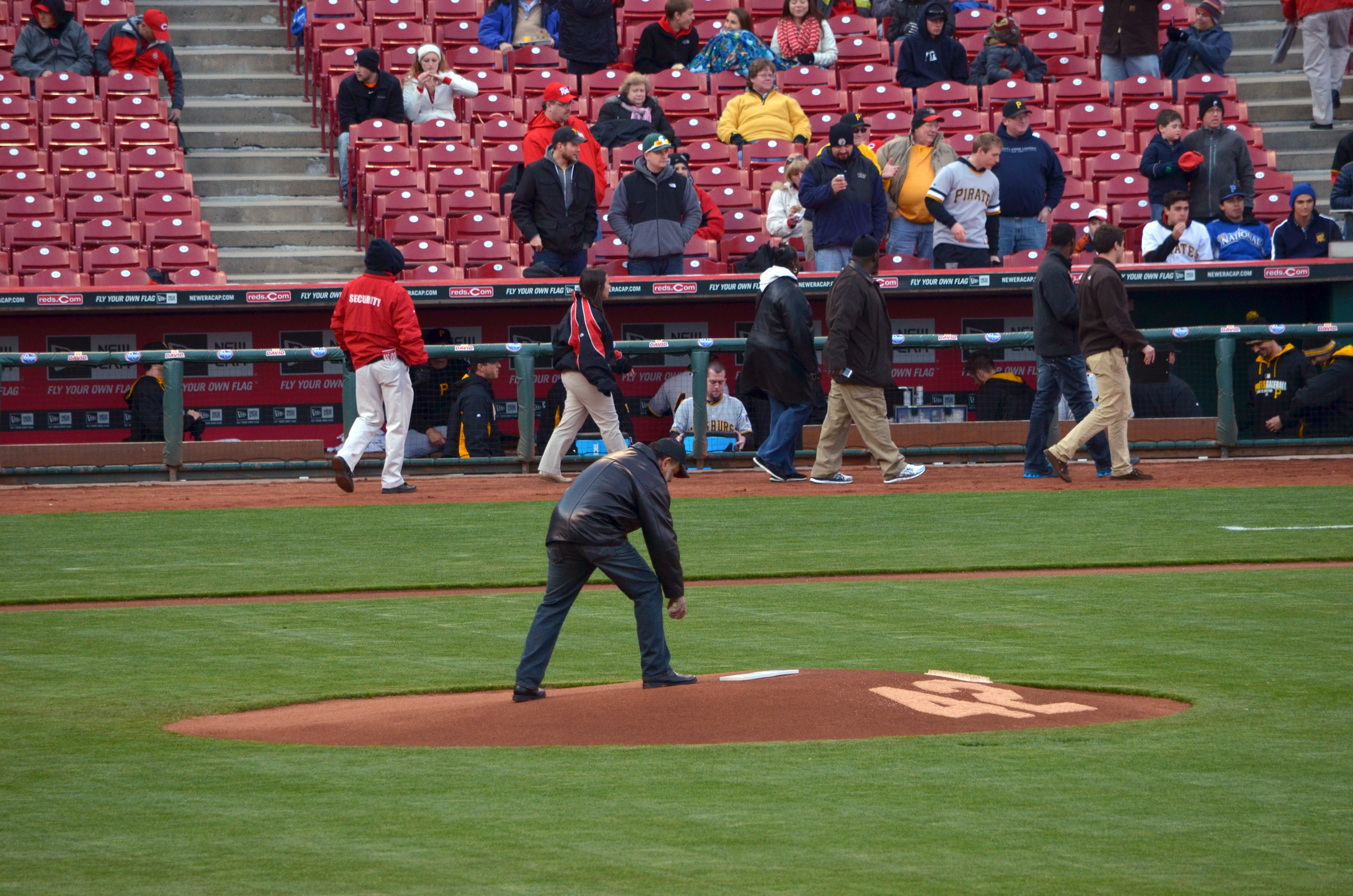  Clay Holland (Owner and President) placing opening game ball on pitcher's mound. 