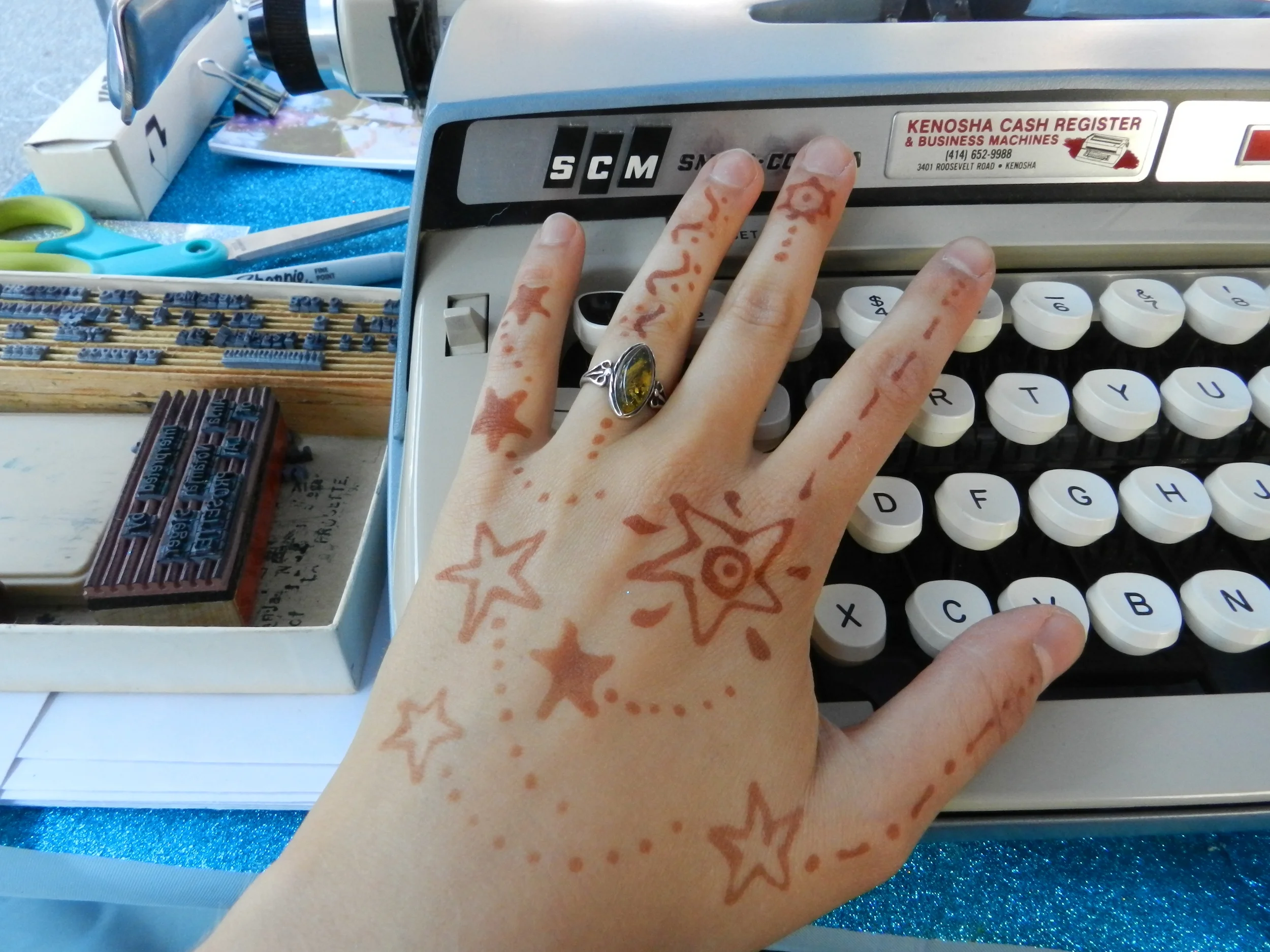 Renee Bebeau prepared my hands with cosmic henna for optimal space transcription.